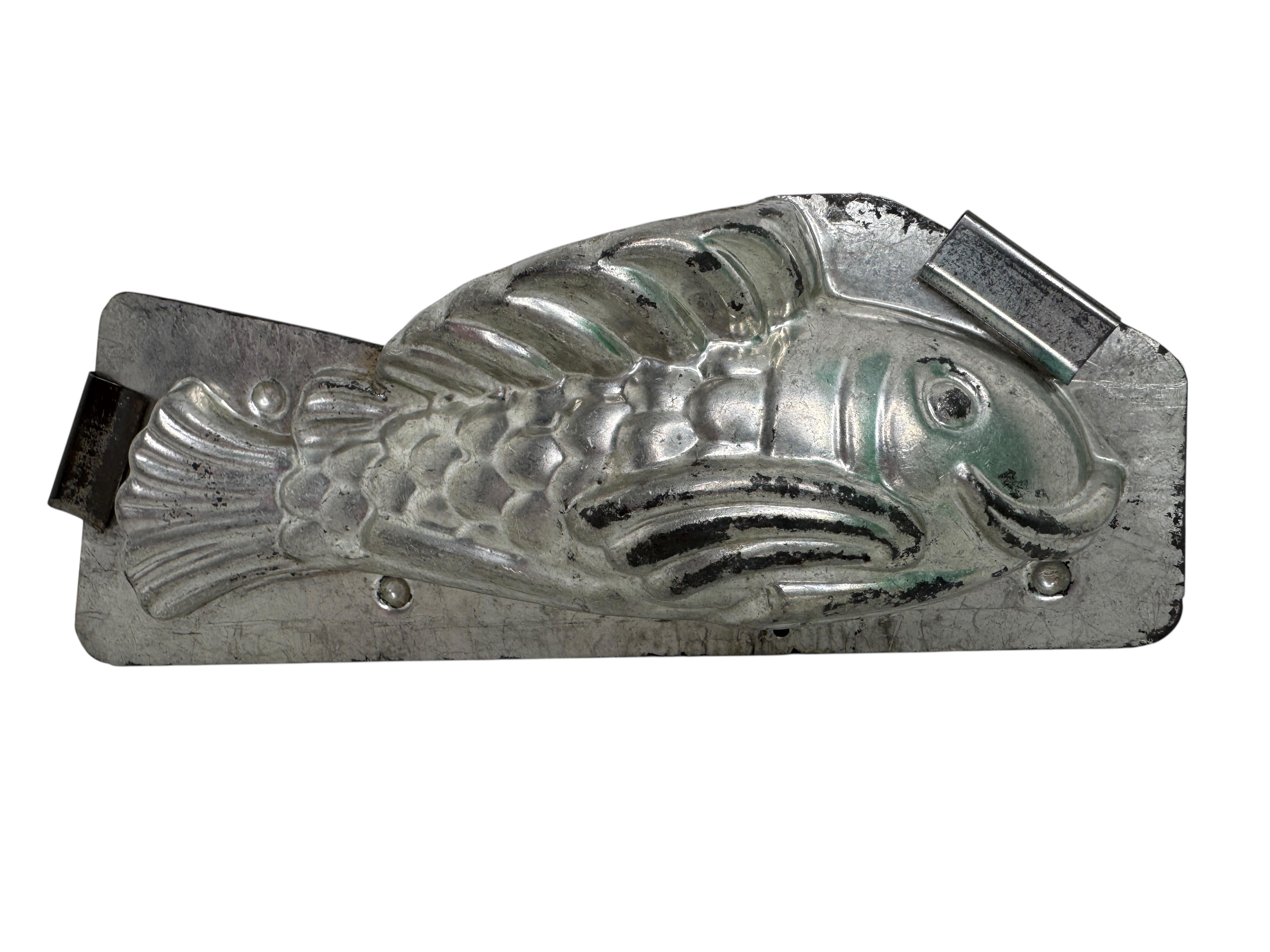 A gorgeous chocolate mold. Made of metal, marked with mold number. Beautiful and ready to use or display, with nice patina.
The 1890s to 1920s were the golden age of Chocolate production and consumption throughout Europe. Many cities and towns had