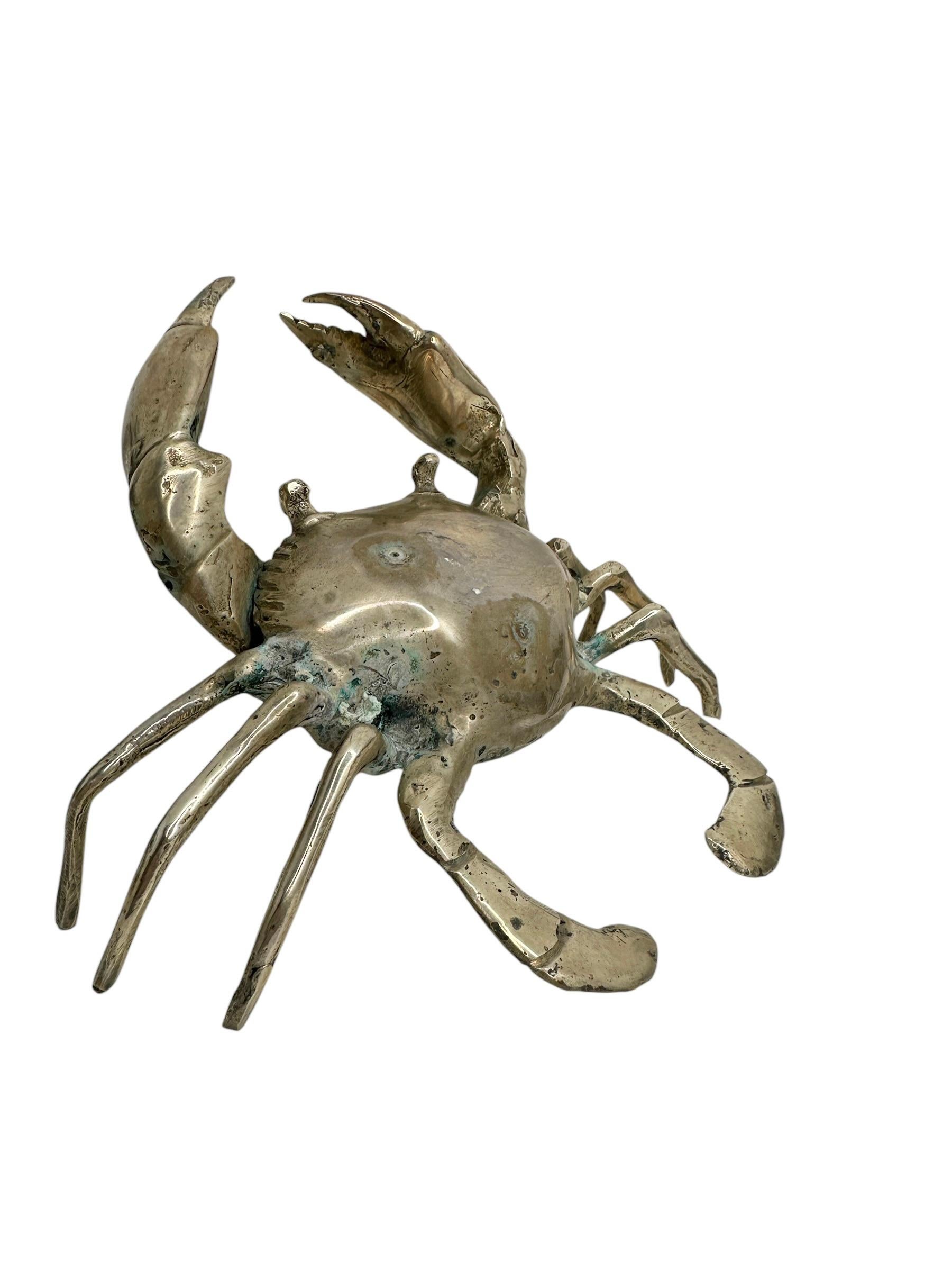 This nickel plated metal crab statue was most likely made in the 1980s in Italy. Can not tell the maker or the artist and it is not signed. This particular crab statue is a beautiful piece, it can be displayed as a sculptural focal point on a