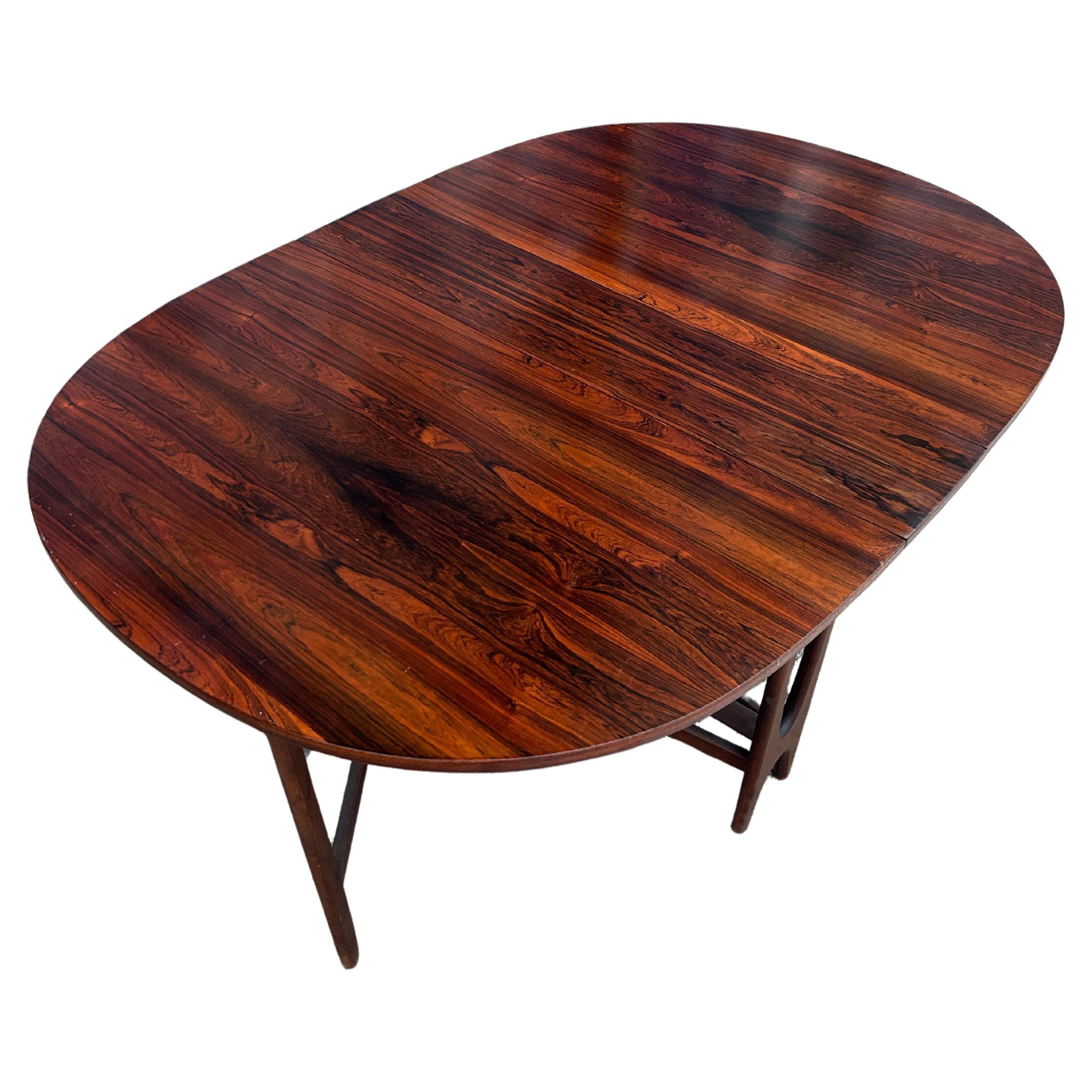 Norwegian Beautiful Danish modern rosewood oval folding drop leaf dining table For Sale