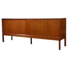 Beautiful Danish modern teak credenza with sliding doors by Aksel Kjersgaard