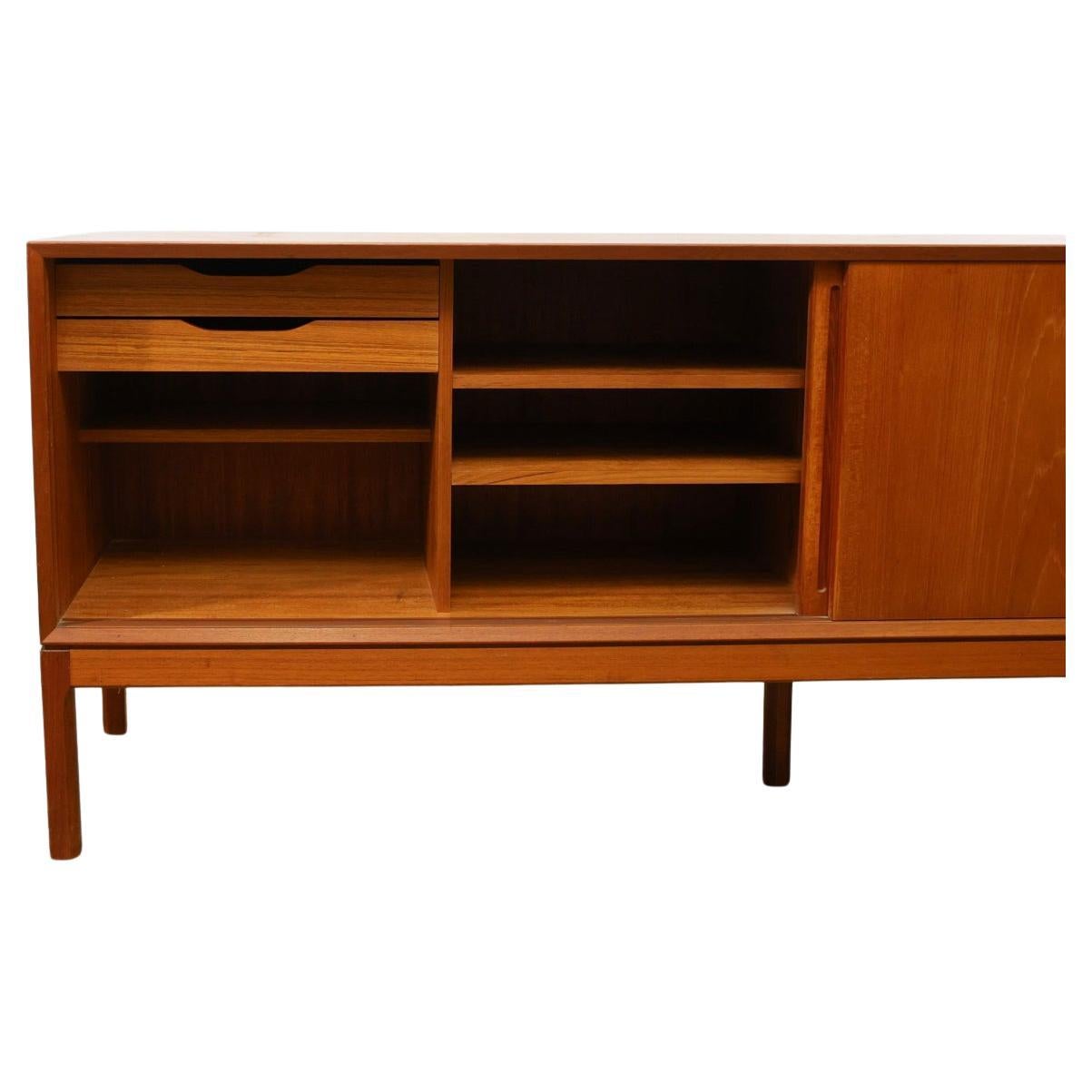 Scandinavian Modern Beautiful Danish modern teak credenza with sliding doors by Aksel Kjersgaard For Sale