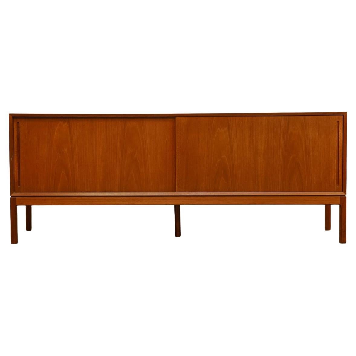 Mid-20th Century Beautiful Danish modern teak credenza with sliding doors by Aksel Kjersgaard For Sale