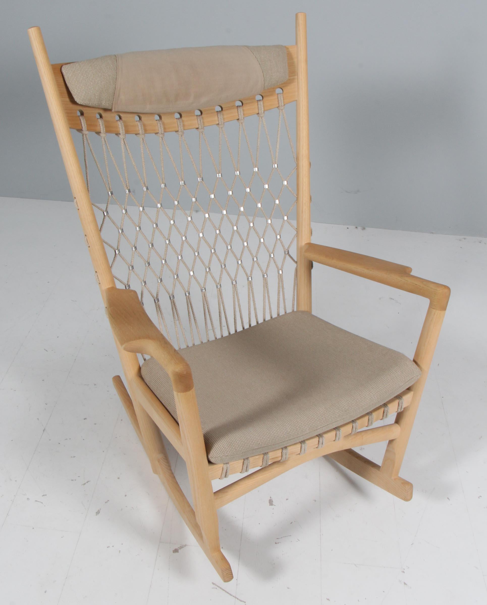 Danish rocking chair by Hans J. Wegner for PP Møbler,. Frame of soap treated ash, upholstery of Vibeke Klint Fabric. Flagline in the back.

Model PP124 named Net Chair, made by PP Møbler.

