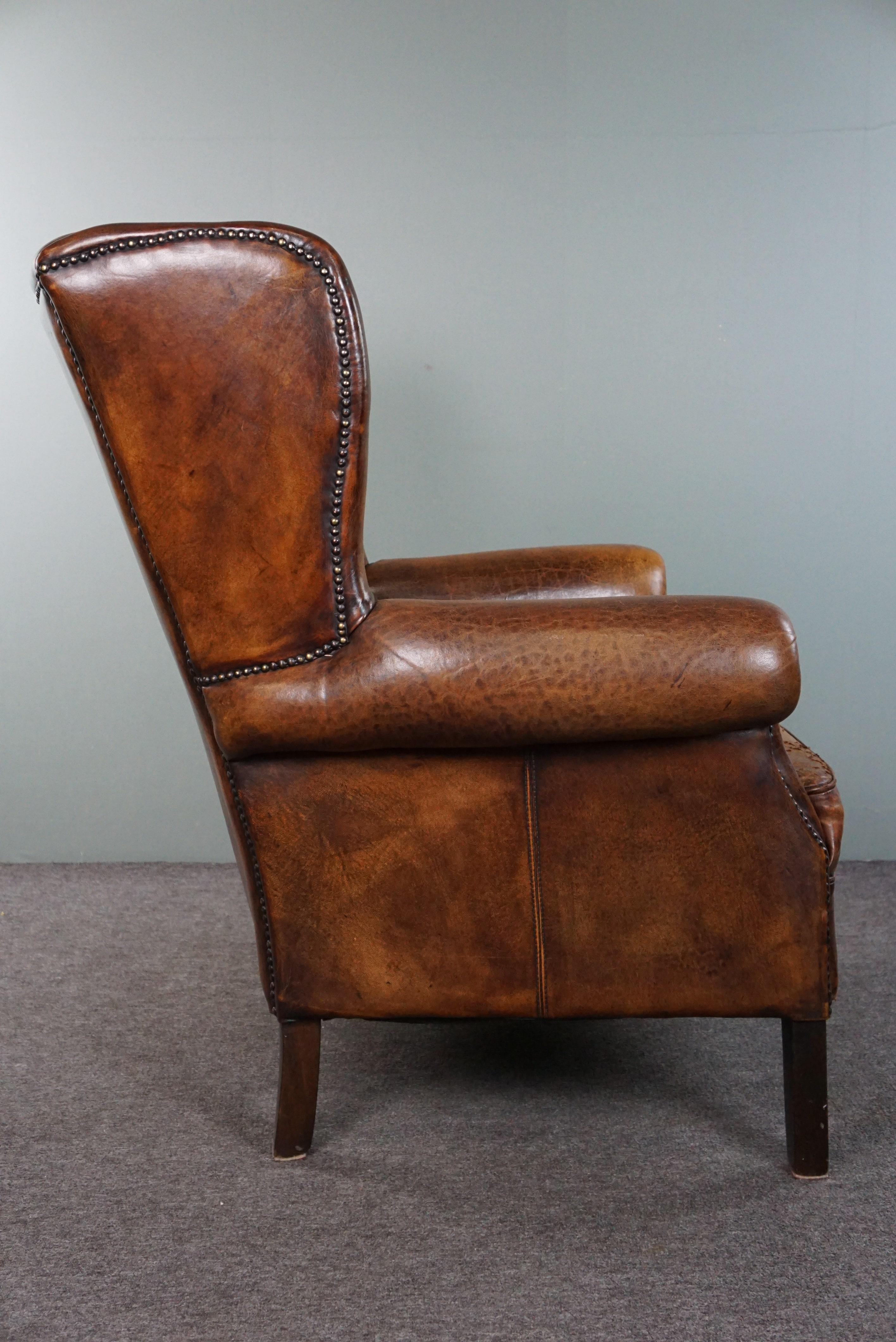 Hand-Crafted Beautiful dark wing chair made of sheep leather with beautiful colors For Sale