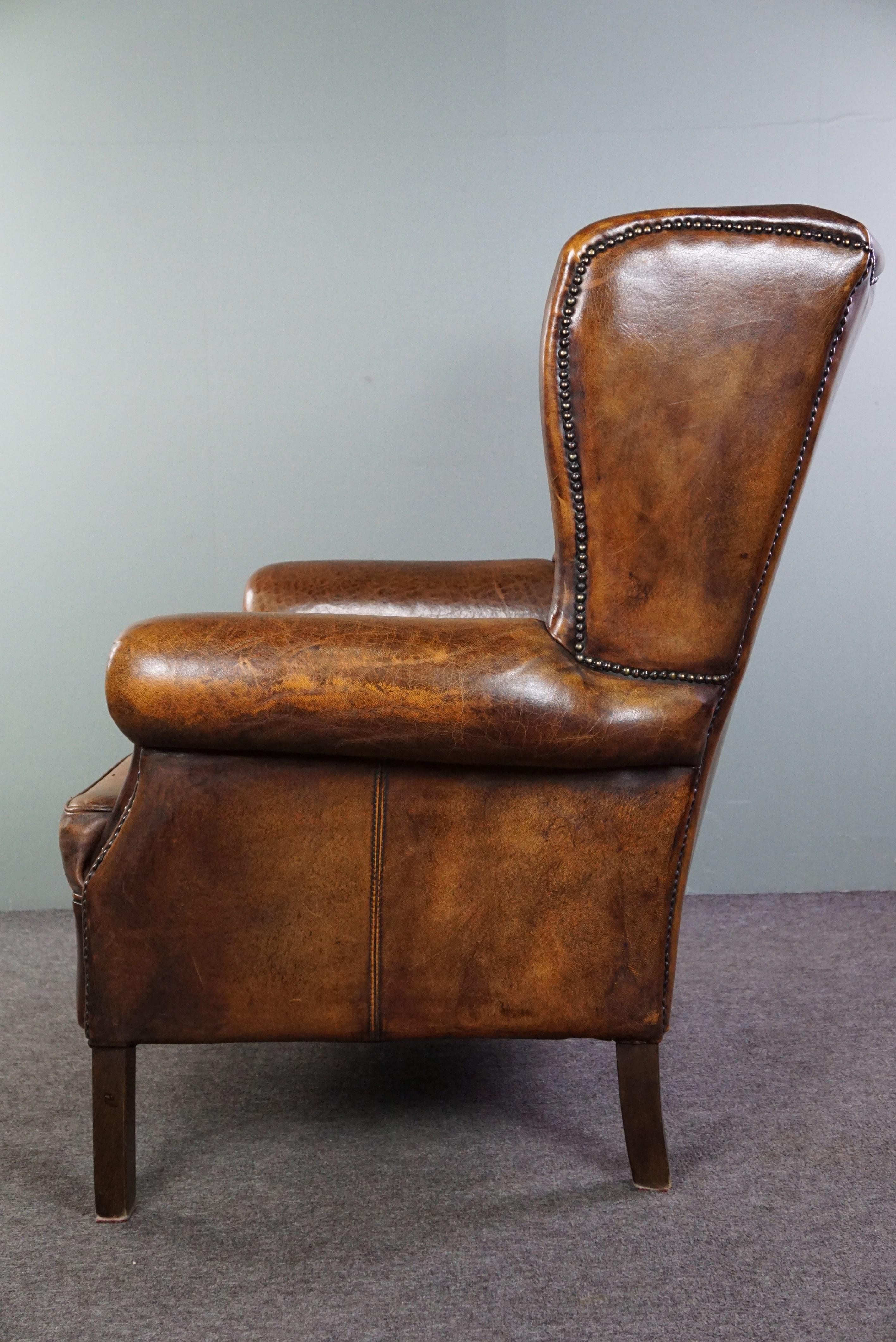 Contemporary Beautiful dark wing chair made of sheep leather with beautiful colors For Sale