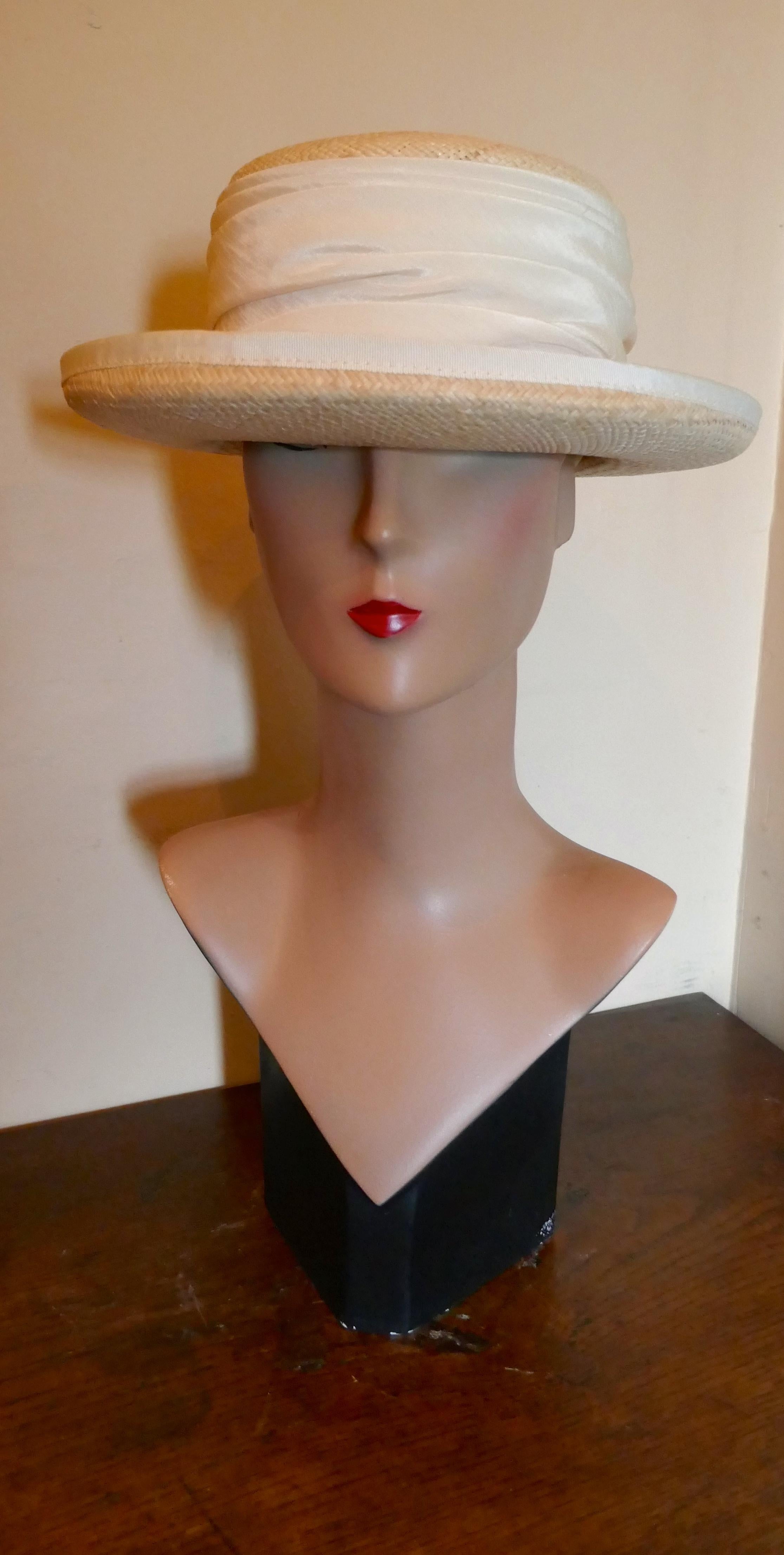 Beautiful 1970s Deep Brim Boater Panama Hat by BASKA Design London 

Superb Panama hat with fabric Ivory trim to the curled brim and and deep gathered Ivory hat band to the crown

The hat is very fine quality and in good condition, it is made by
