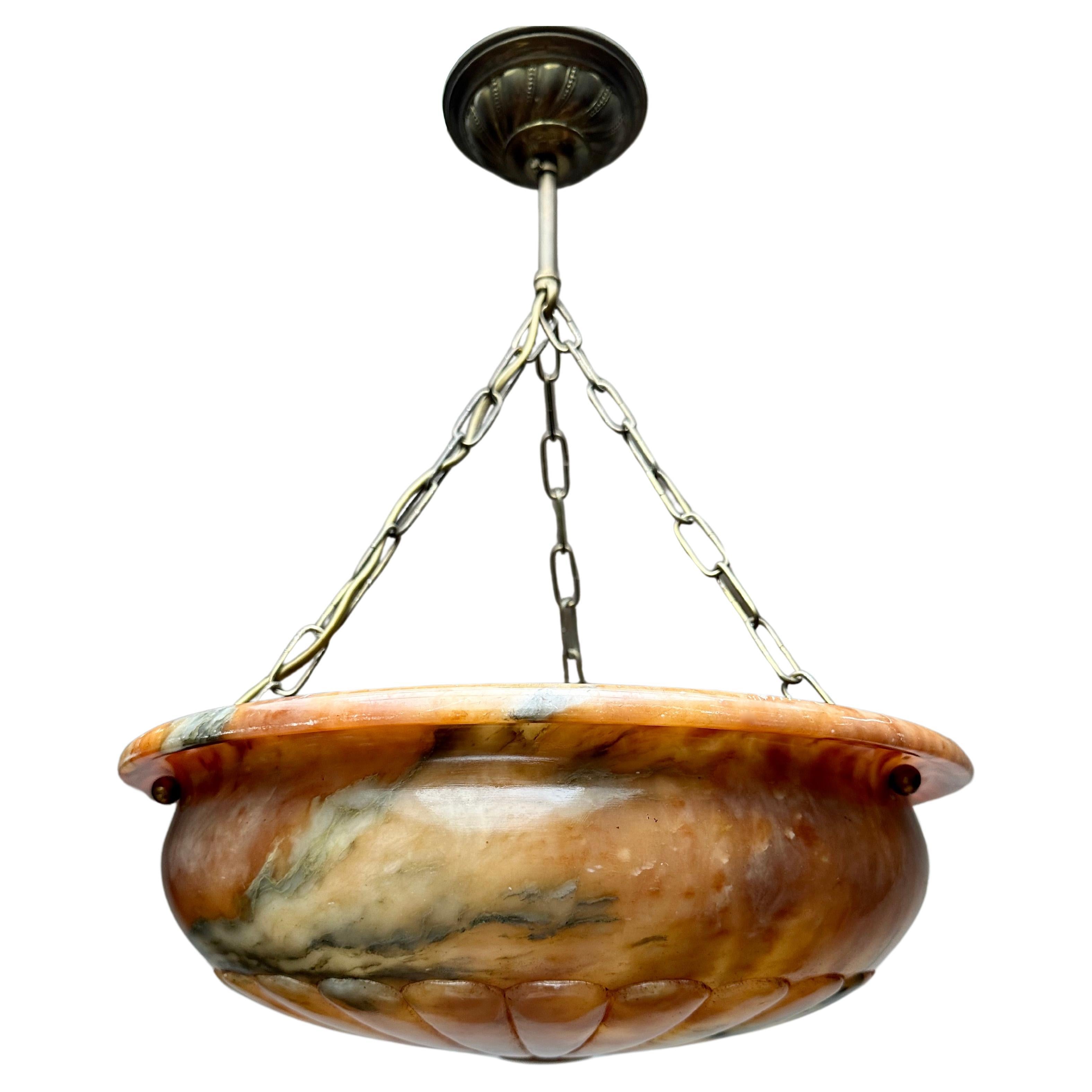 One of a kind and perfectly balanced light fixture with a stunning alabaster shade.

Thanks to its beautiful and classical design and its truly good condition this perfectly balanced alabaster chandelier too will light up both your days and evenings