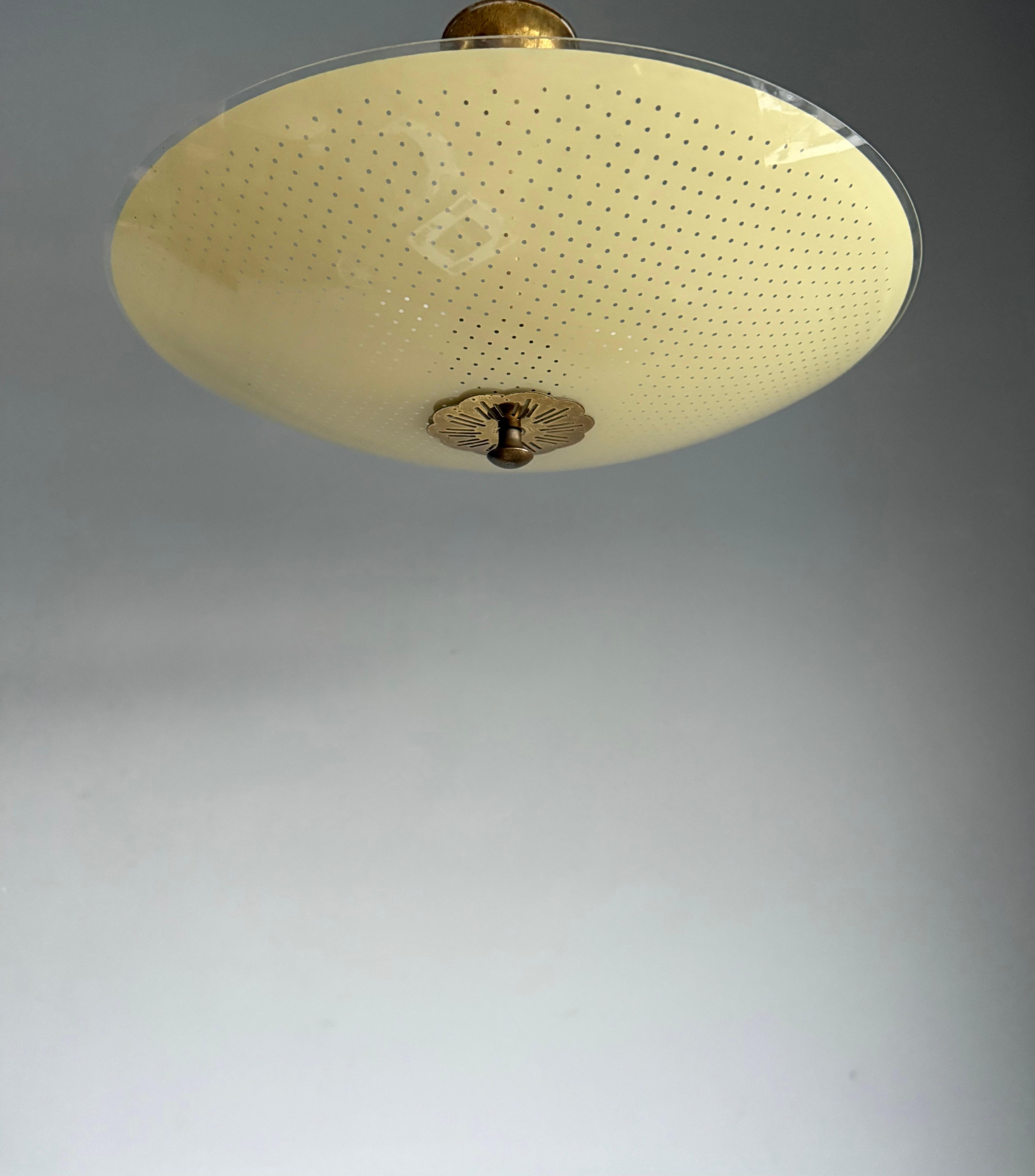 Another beautiful design, Art glass pendant from the Mid-Century Modern era.

This rare, small holes-pattern flush mount has a marvelous, rounded shade with striking colors and both with the light switched on and off this aesthetically pleasing