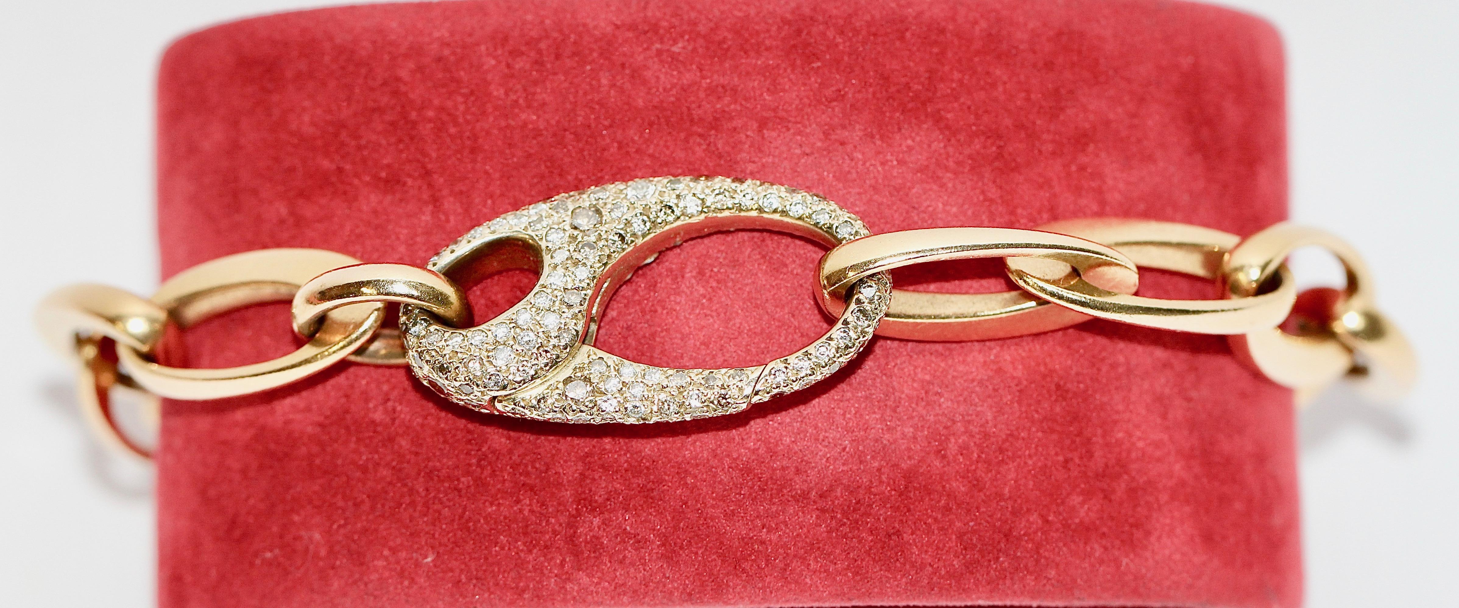 Beautiful designer bracelet made by Pomellato. 18k gold with diamonds.

Clasp fully set with diamonds.