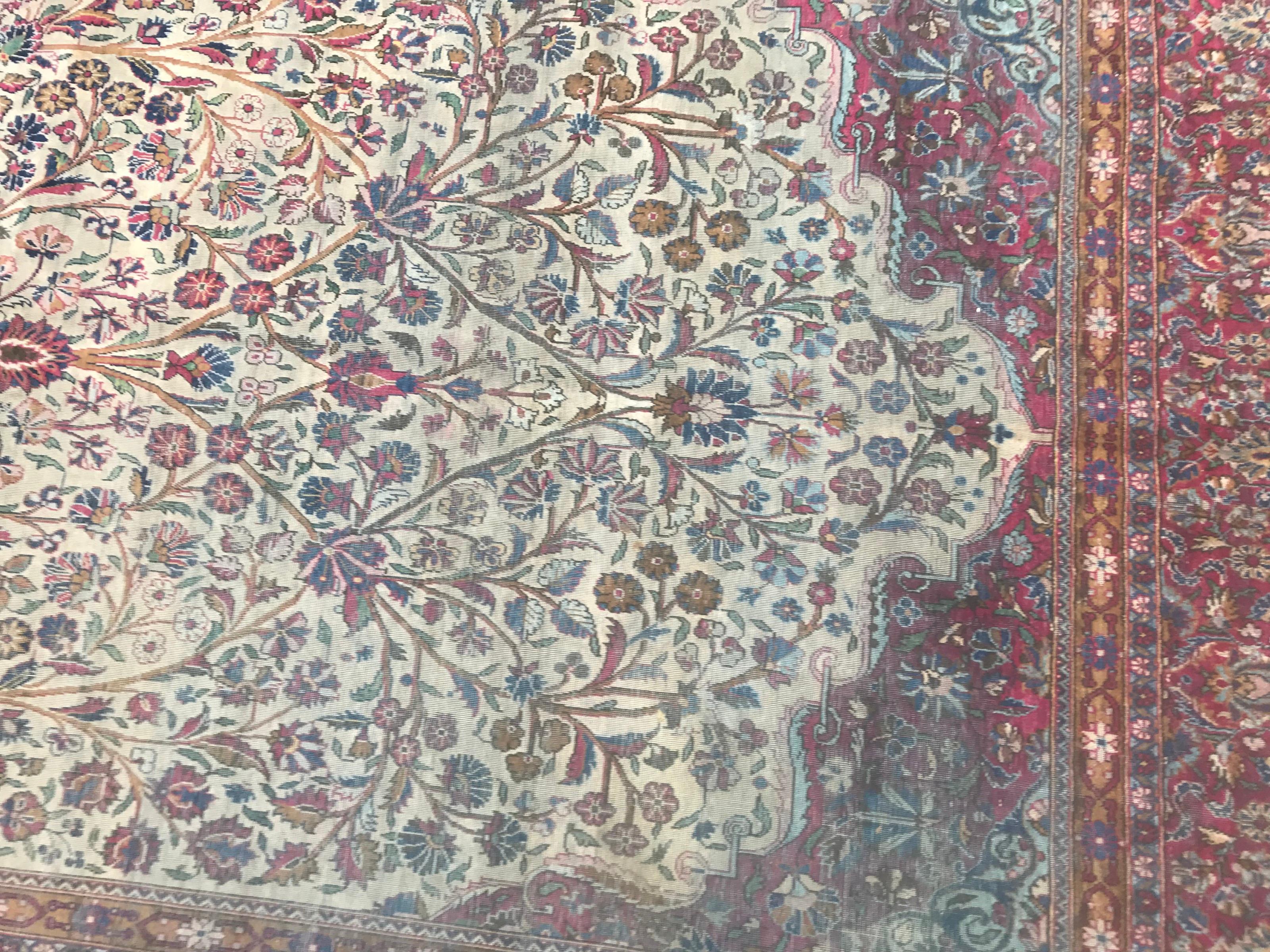 A distressed silk rug, very finely hand knotted with a very beautiful garden floral silk and nice colors with red, blue, pink, green, purple and yellow, entirely and finely hand knotted with silk velvet on cotton foundation.