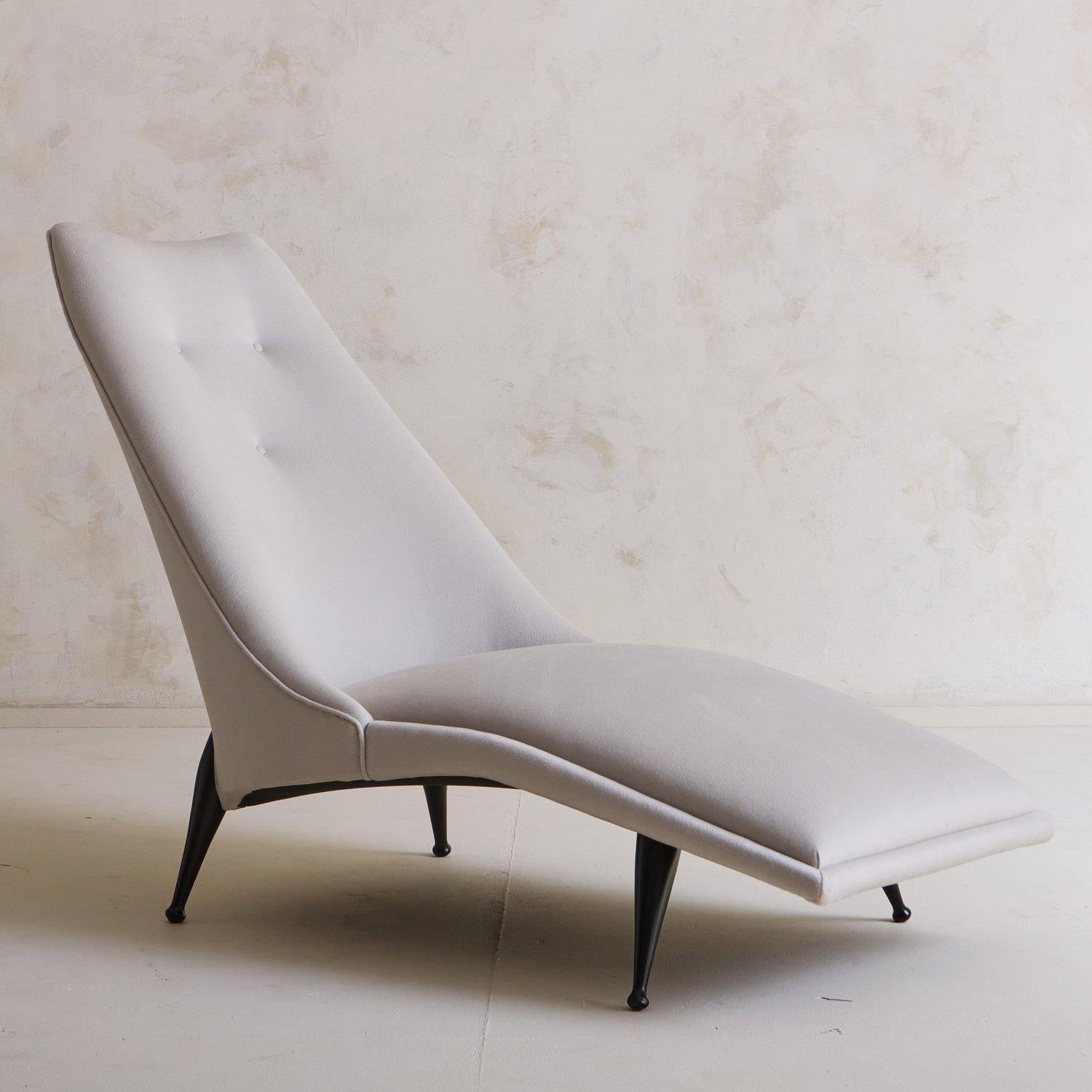 A rare ‘Beautiful Dreamer’ chaise lounge designed by Ben Seibel in the 1950s. This lounge has an elongated curved seat and a dramatically angled back with three tufts and welt detailing. It was newly reupholstered in a pale gray wool blend fabric