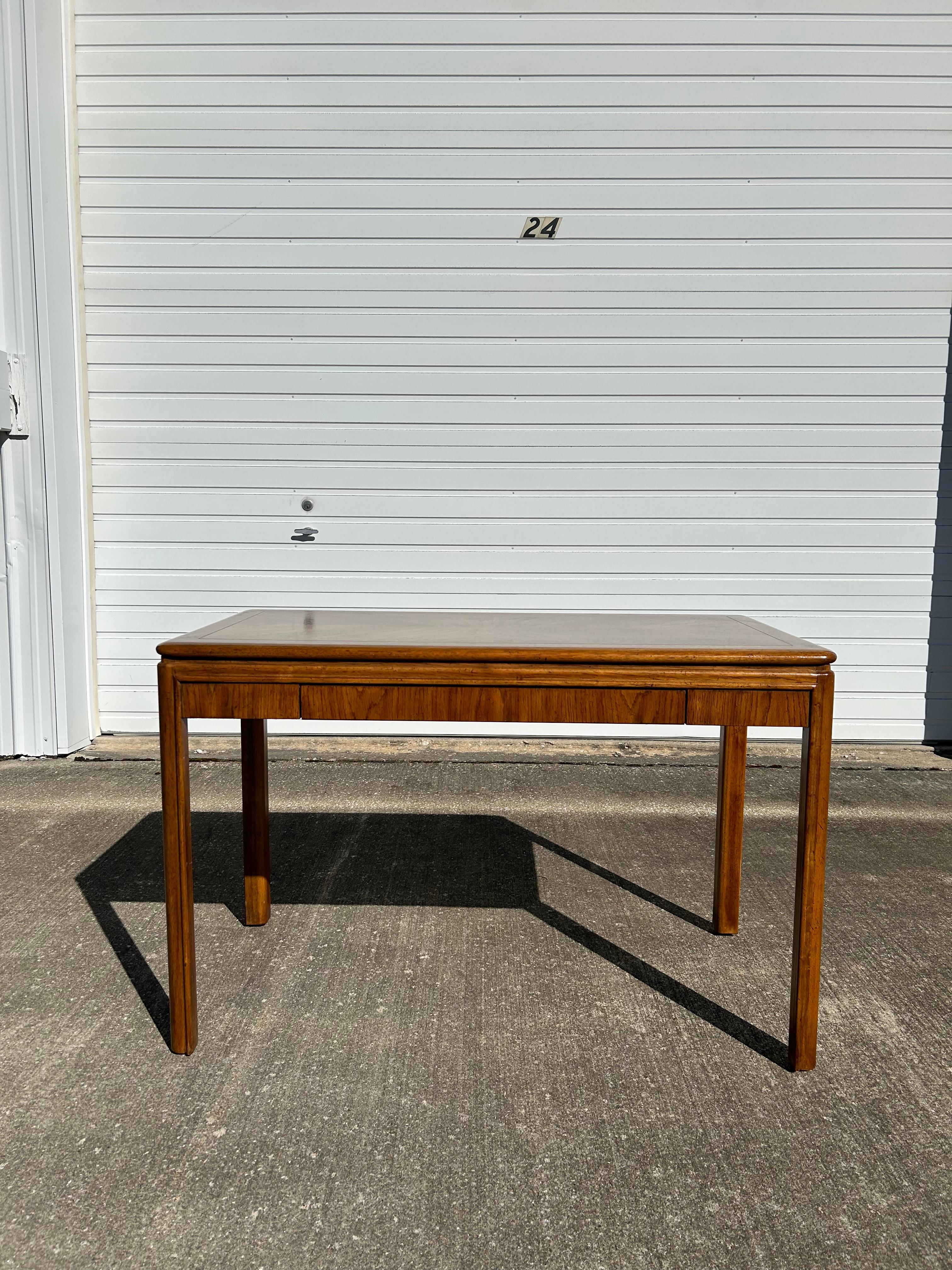 A beautiful and rare piece from Drexel Passage, a writing table or desk made to last for decades. (It can also be used as a console table) The wood design of the table is magnificently beautiful with a 