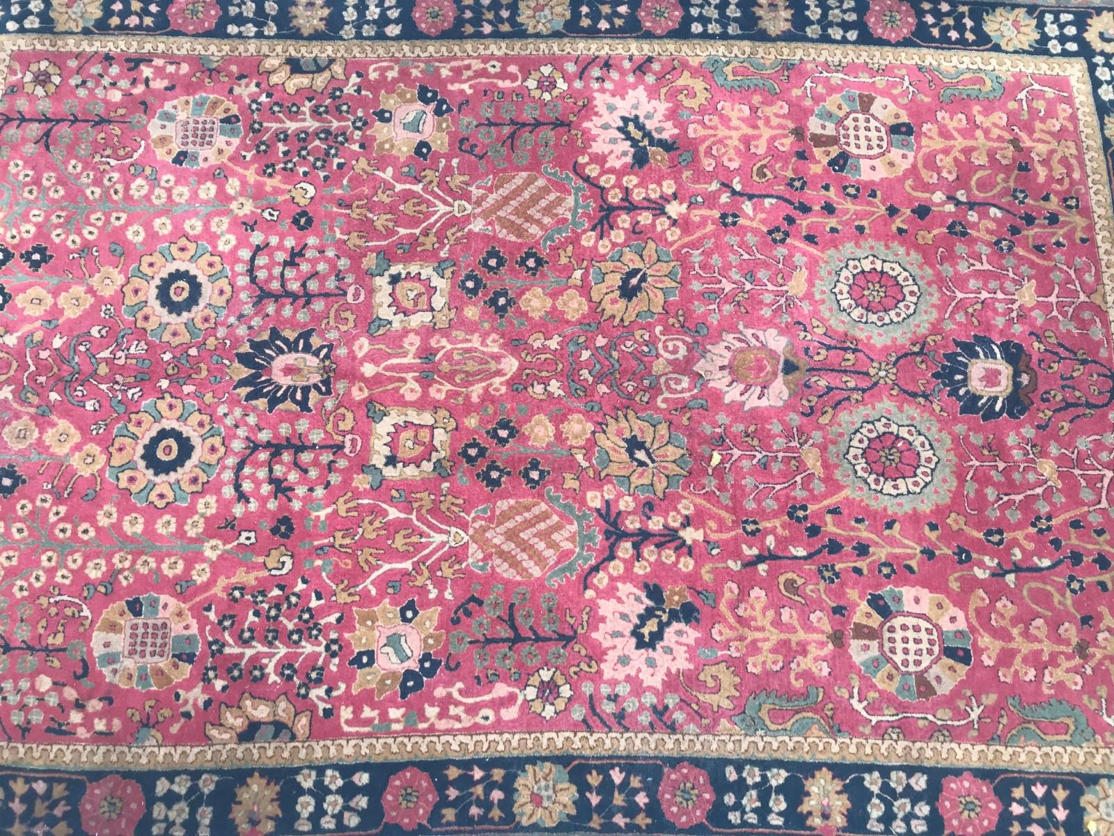Nice French Janus rug, with a Indian Agra design and beautiful colors with pink, yellow black and green, entirely handmade with “point de Lys” method, wool velvet on cotton foundation, very decorative.
