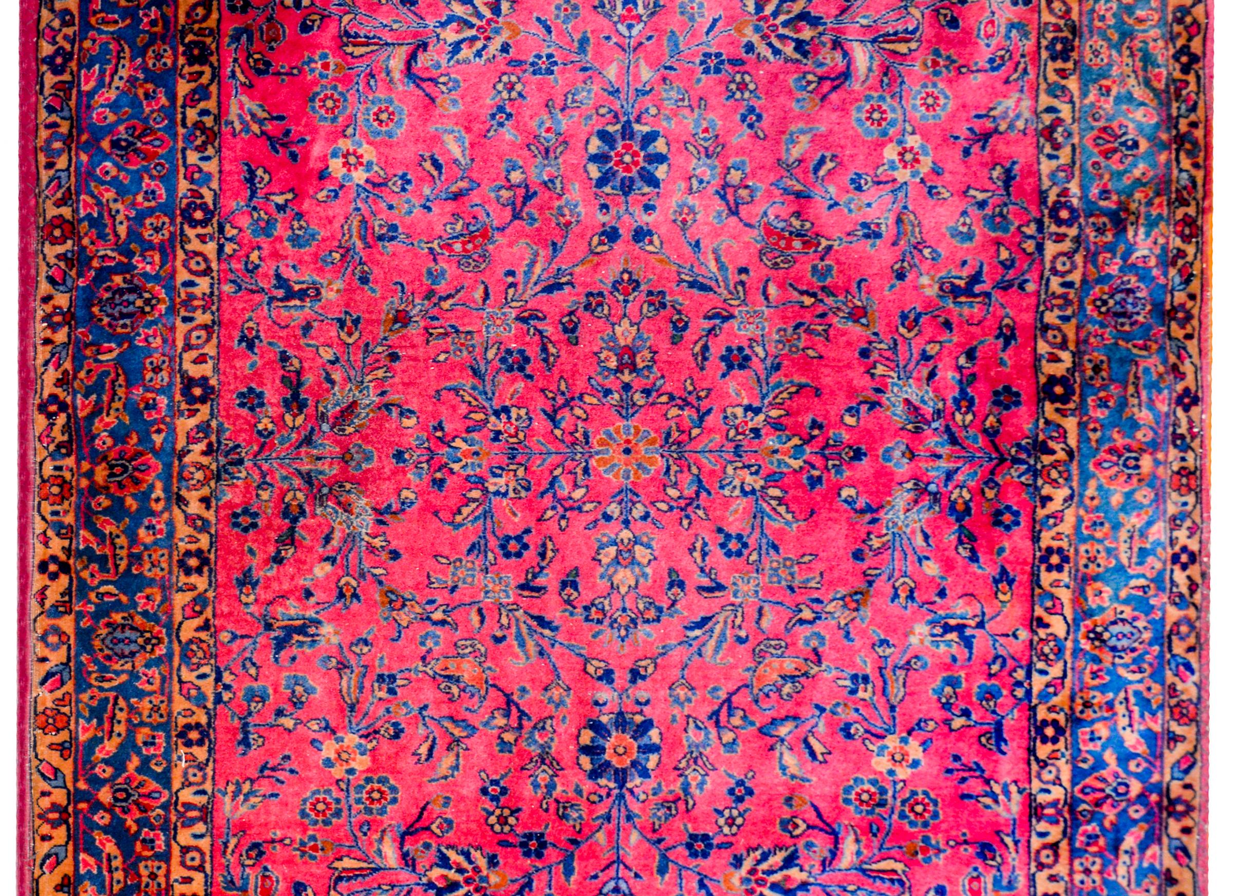 A beautiful early 20th century Persian Kashan rug woven in extremely soft wool from Manchester, England, with a fantastic mirrored floral and scrolling vine pattern and arranged in a way that it created a circular pattern around the central