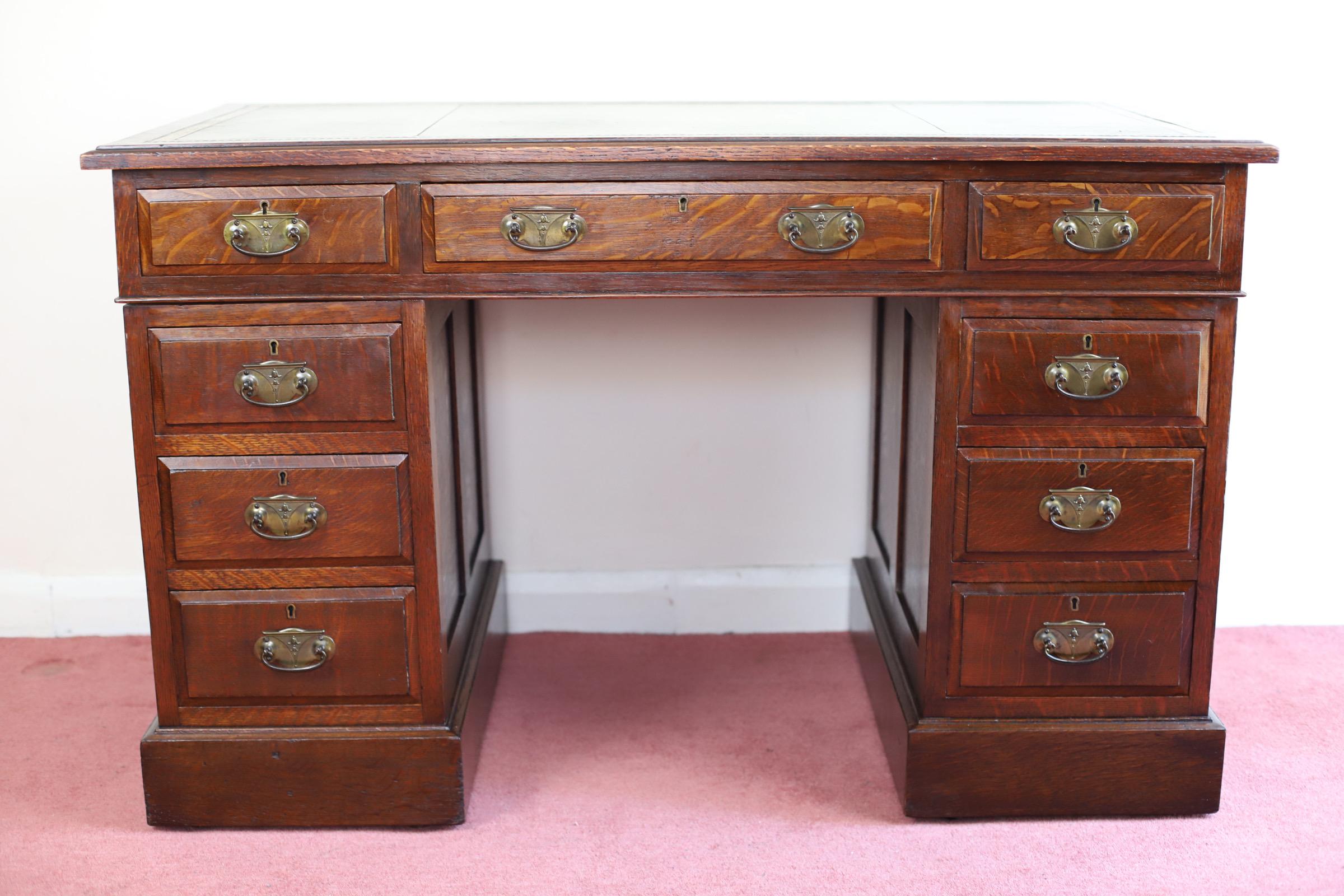We delight to offer for sale this beautiful pedestal desk which separates in to three pieces and has a green tooled leather top with gold edging, nine drawers with brass handles and is raised on plinth base.
with wear & tear commensurate with age