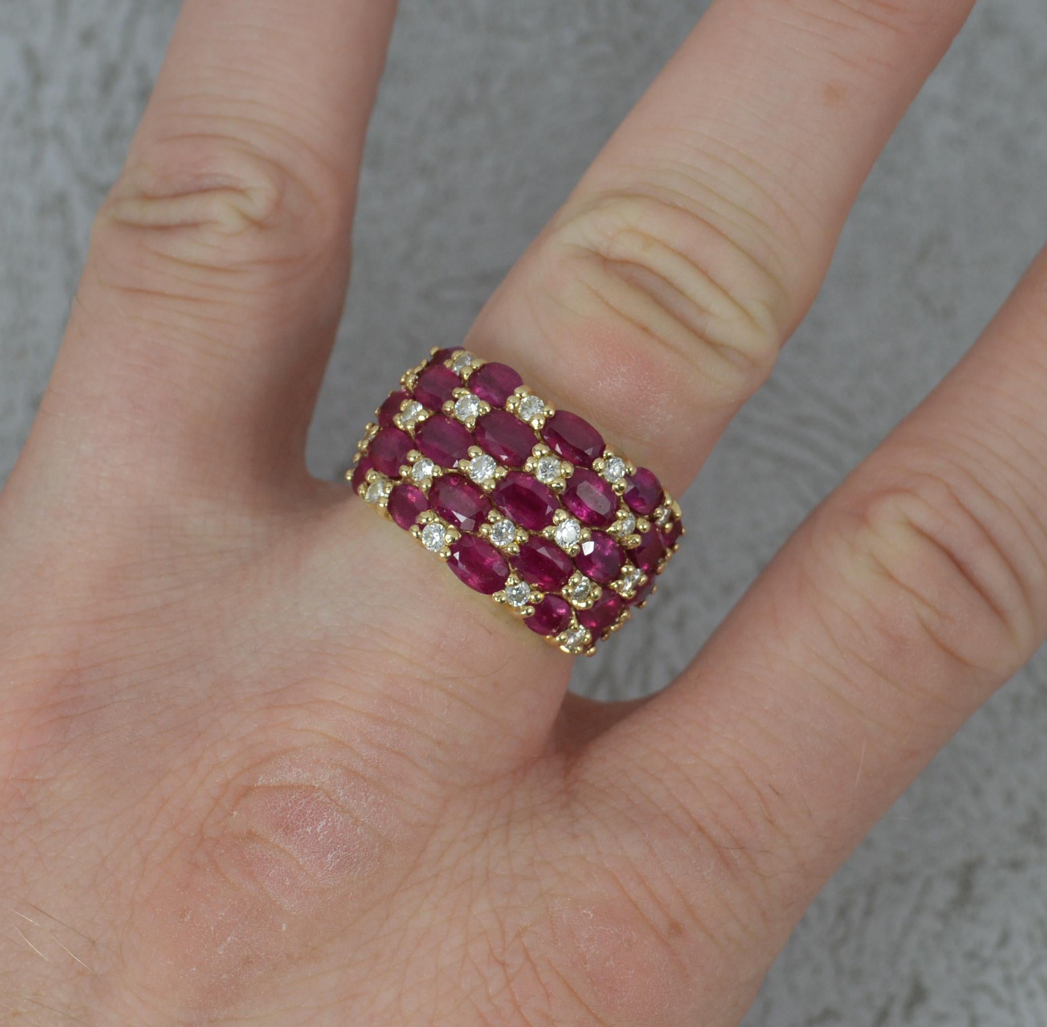 A superb Effy designer cluster ring.
Solid 14 carat yellow gold example.
Designed as a large, bombe style cluster ring. Five row shape with alternating oval cut rubies and round brilliant cut diamonds.
23.1mm x 13.8mm cluster head.

CONDITION ; Very