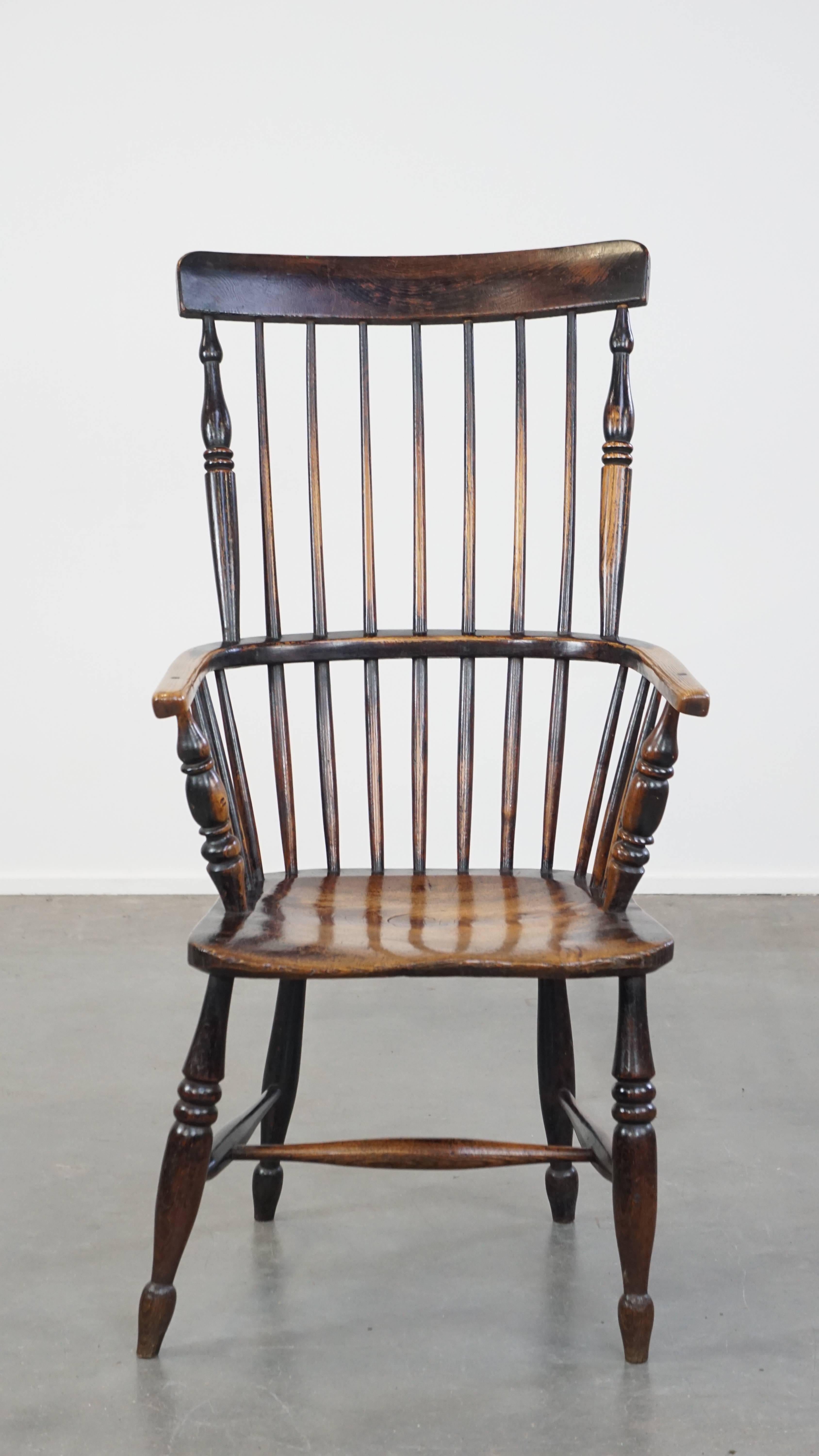 This exquisite antique Windsor dining chair has developed a wonderful patina over the years. It features a spindled backrest and a beautifully shaped seat. Not only is it functional, but it also adds elegance and character to almost any interior.