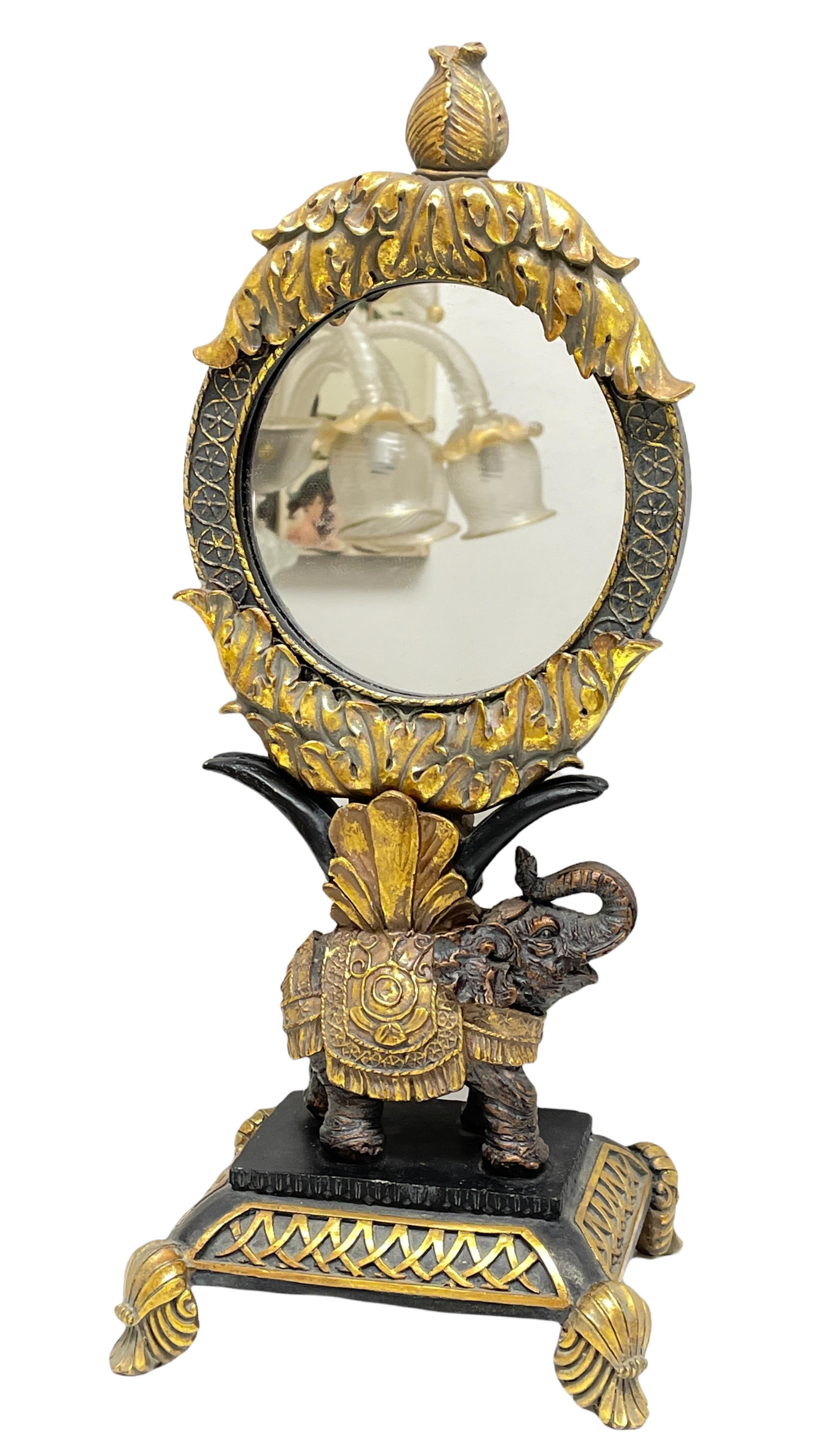 A gorgeous vanity mirror on a elephant stand. With minor signs of wear as expected with age and use. A nice addition to any room.