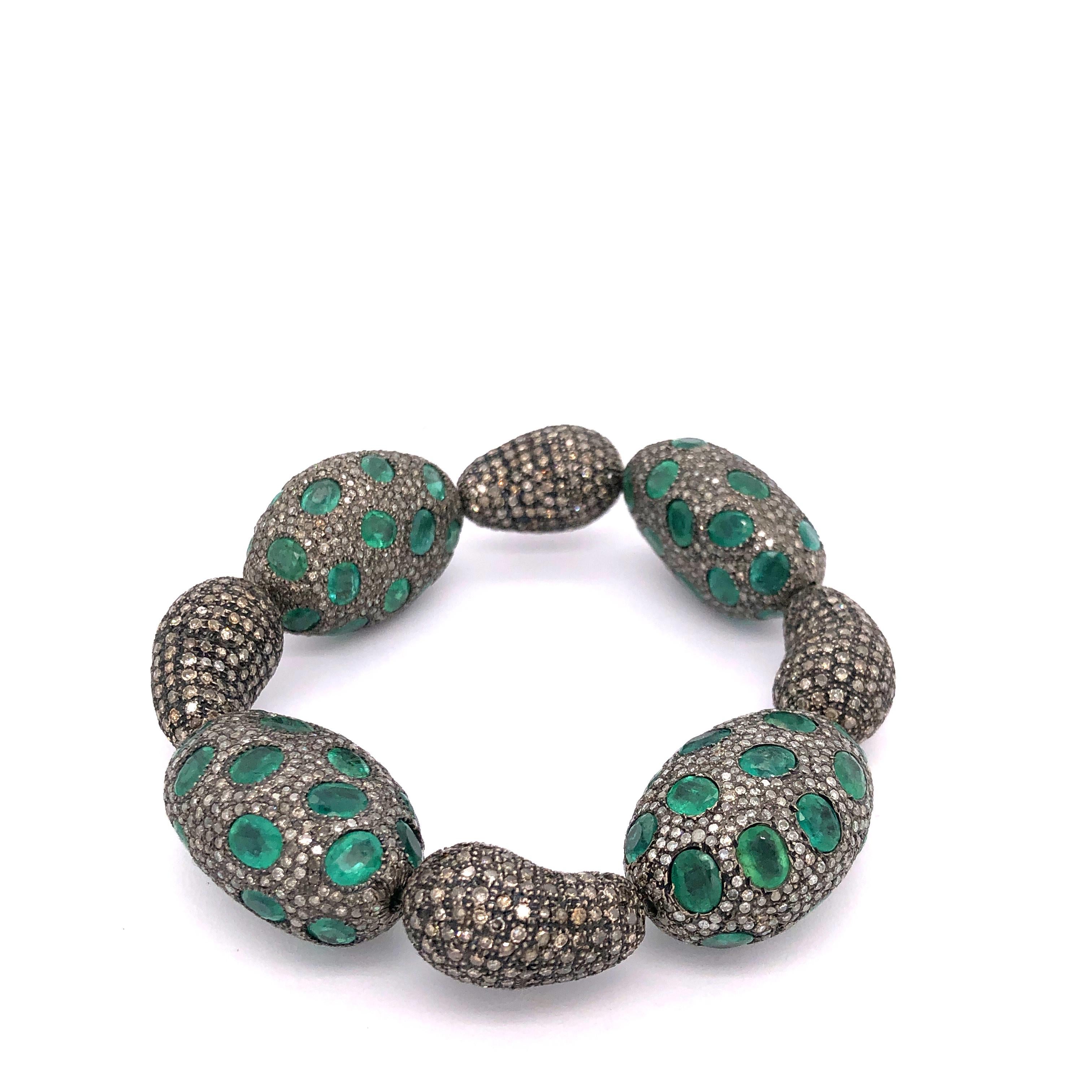 This beautiful pave diamond beads and alternating pave diamond and oval shape emerald bead will complement very well to any of your attire. All the beads are connected together with stretchable plastic cord making easy to slip on.

Silver: