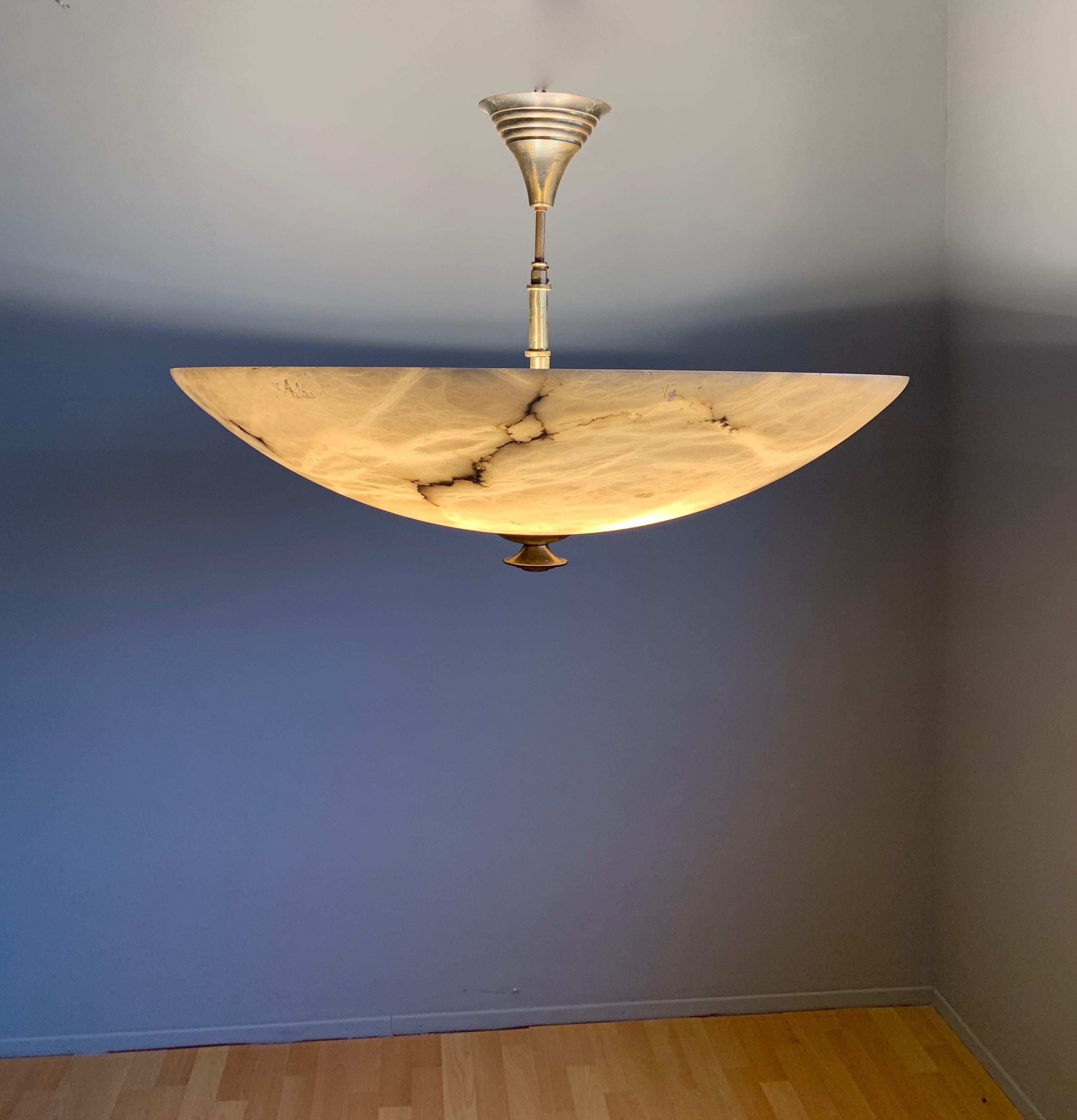 Largest ever and excellent condition Art Deco Style ceiling lamp.

Over the years we have sold a number of beautiful and timeless alabaster light fixtures, but we had never even seen an alabaster fixture of this enormous size. For it to have found