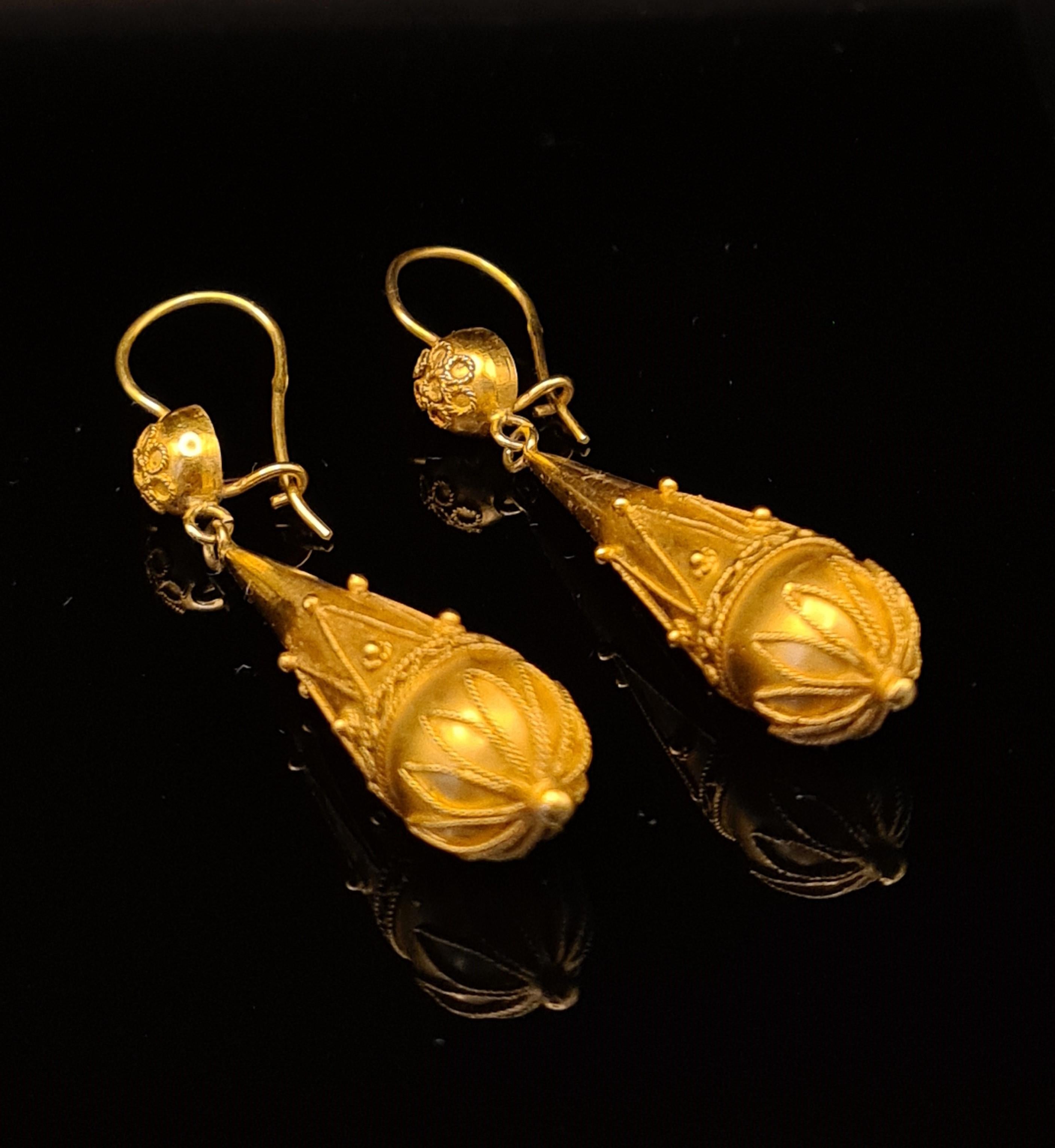 Beautiful Antique Etruscan Revival Long Torpedo Granulation Earrings. 

15 Karat Yellow gold
Finish: Polished Filigree work
Drop length: 2”
Width: 9.40mm±
Gross weight: 5.43 grams
Circa: 1890s
