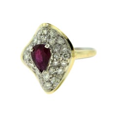 Beautiful Filigree Pear Shaped Ruby and Diamond in White Gold Wave Ring