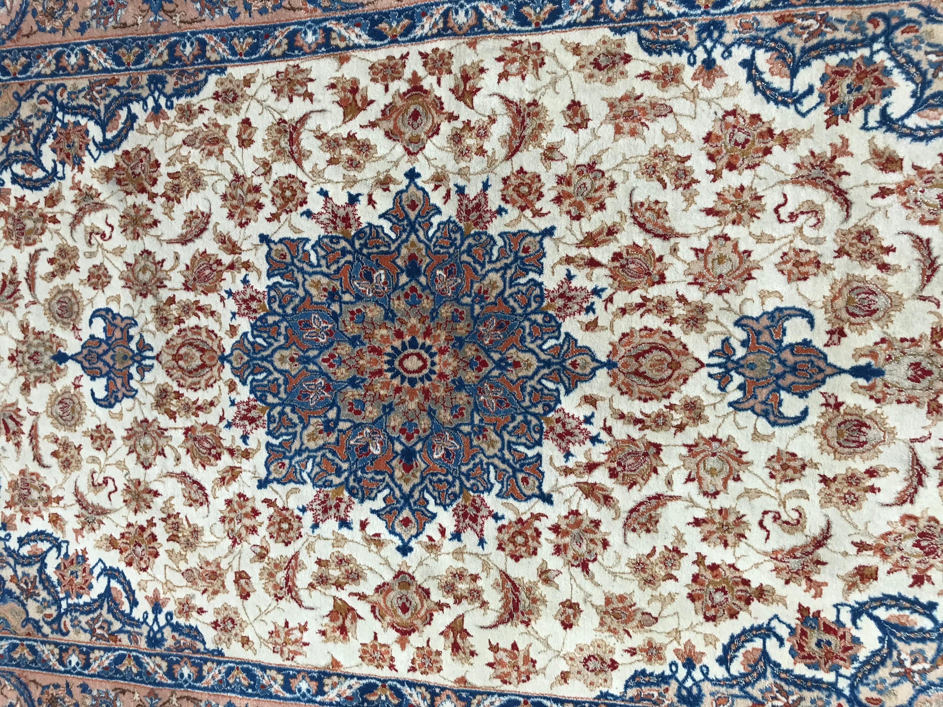 Nice very fine rug with a beautiful fine floral and central medallion design extremely finely hand knotted with wool and silk velvet on silk foundation.