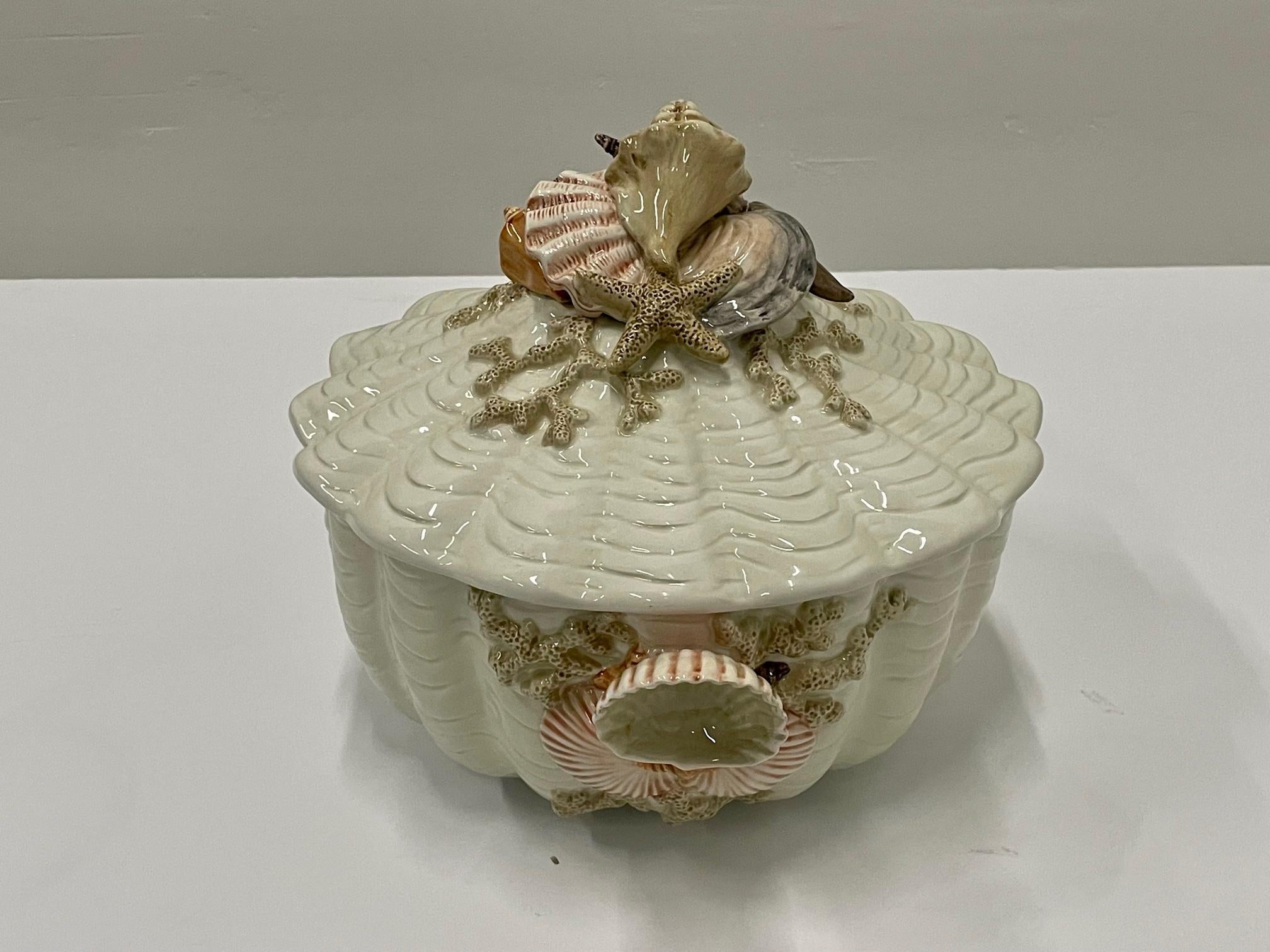 Lovely meticulously detailed Fitz & Floyd tureen having amazing shell decoration on the top of the lid and handles.