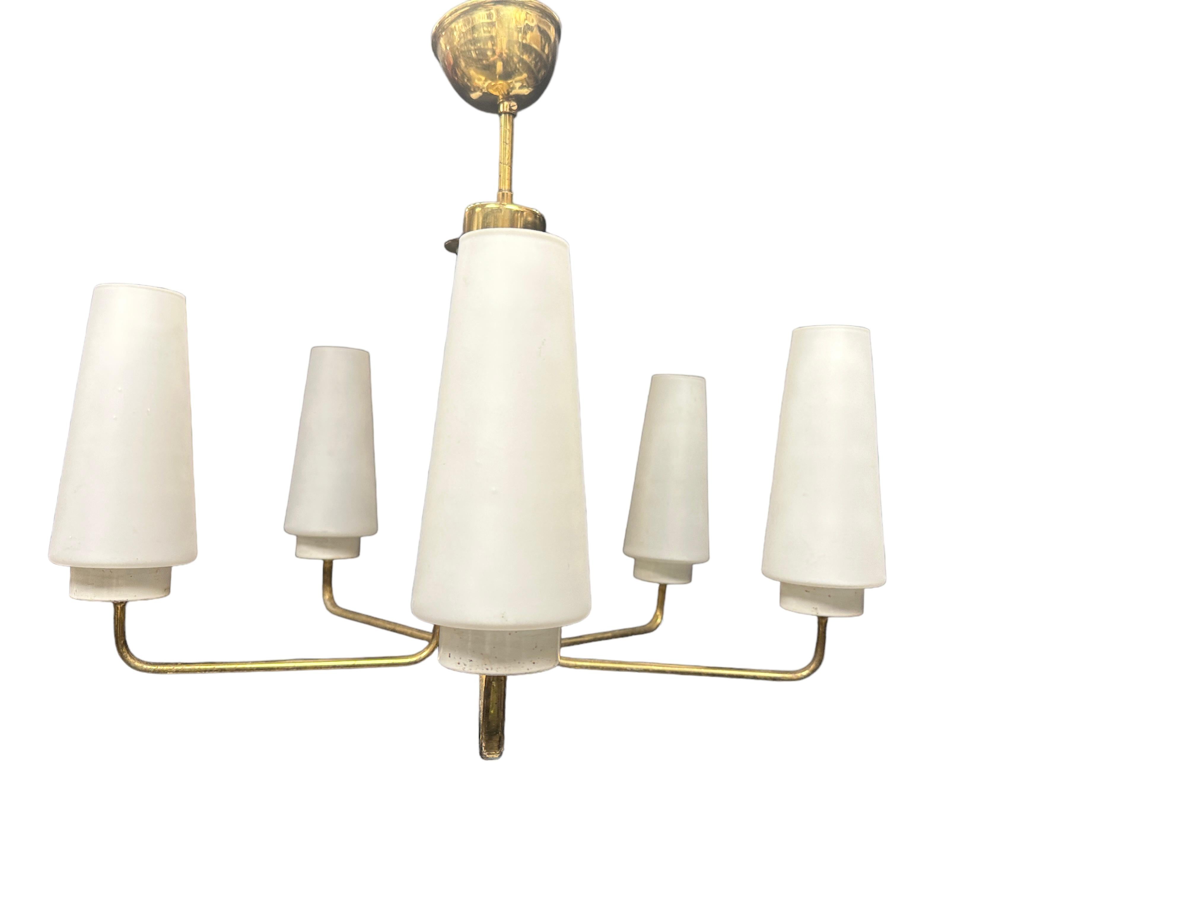 Very decorative and beautiful chandelier made of brass, fitted with five E14 Sockets. Made in Italy in the 1950s, attributed to the famous well known Stilnovo Manufacturer. The Fixture requires five European E14 / 110 Volt Candelabra bulbs, each