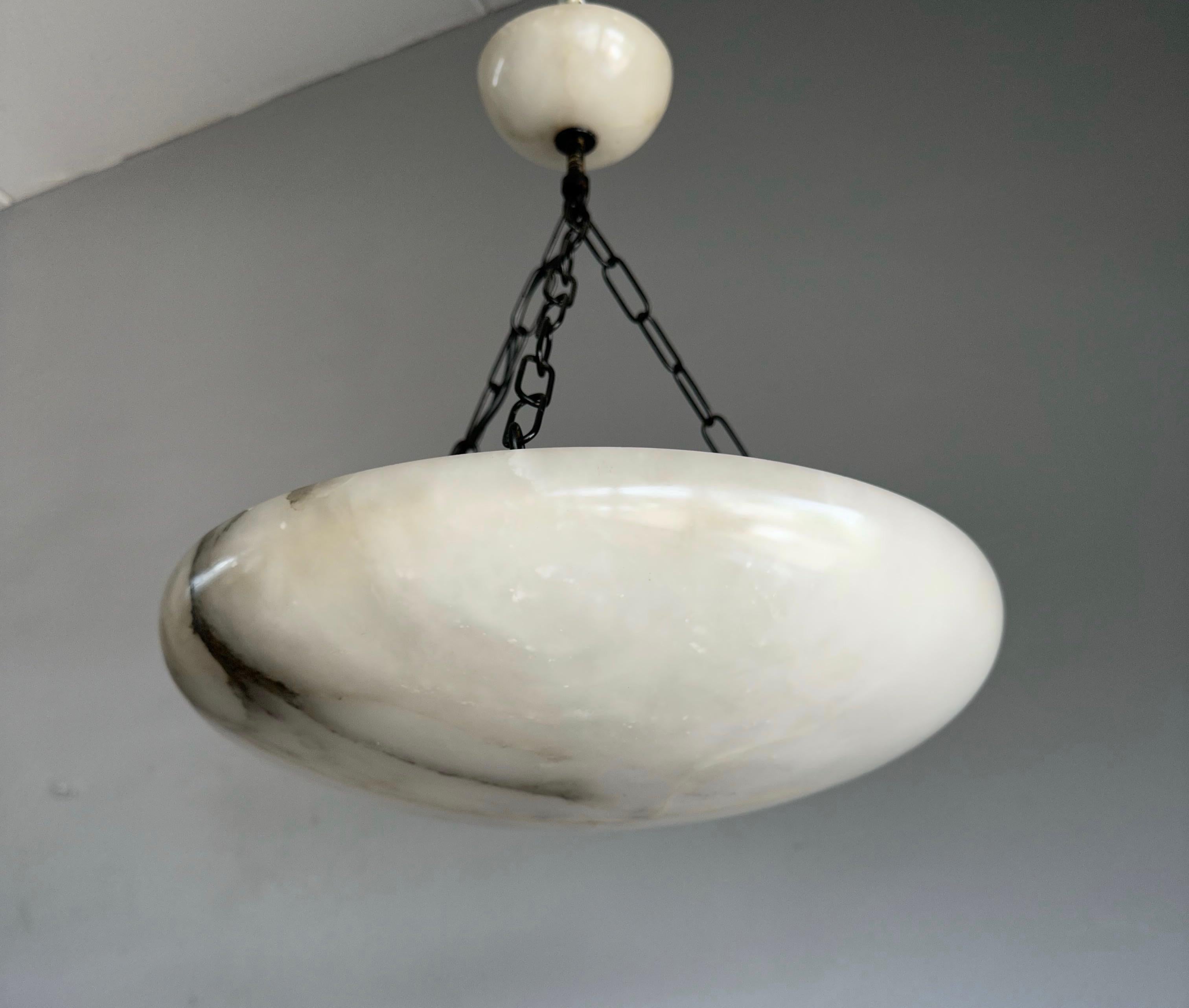 Great shape antique Art Deco ceiling lamp.

This wonderfully designed and truly beautiful light fixture has been very well looked after by its former owners. The rare size and the stylish flat design are very special, but the striking combination of