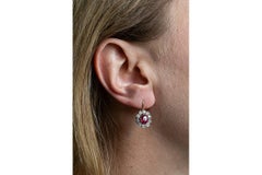 Beautiful flower-shaped earrings with diamonds and synthetic rubies