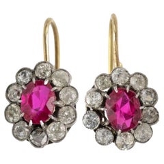 Beautiful flower-shaped earrings with diamonds and synthetic rubies