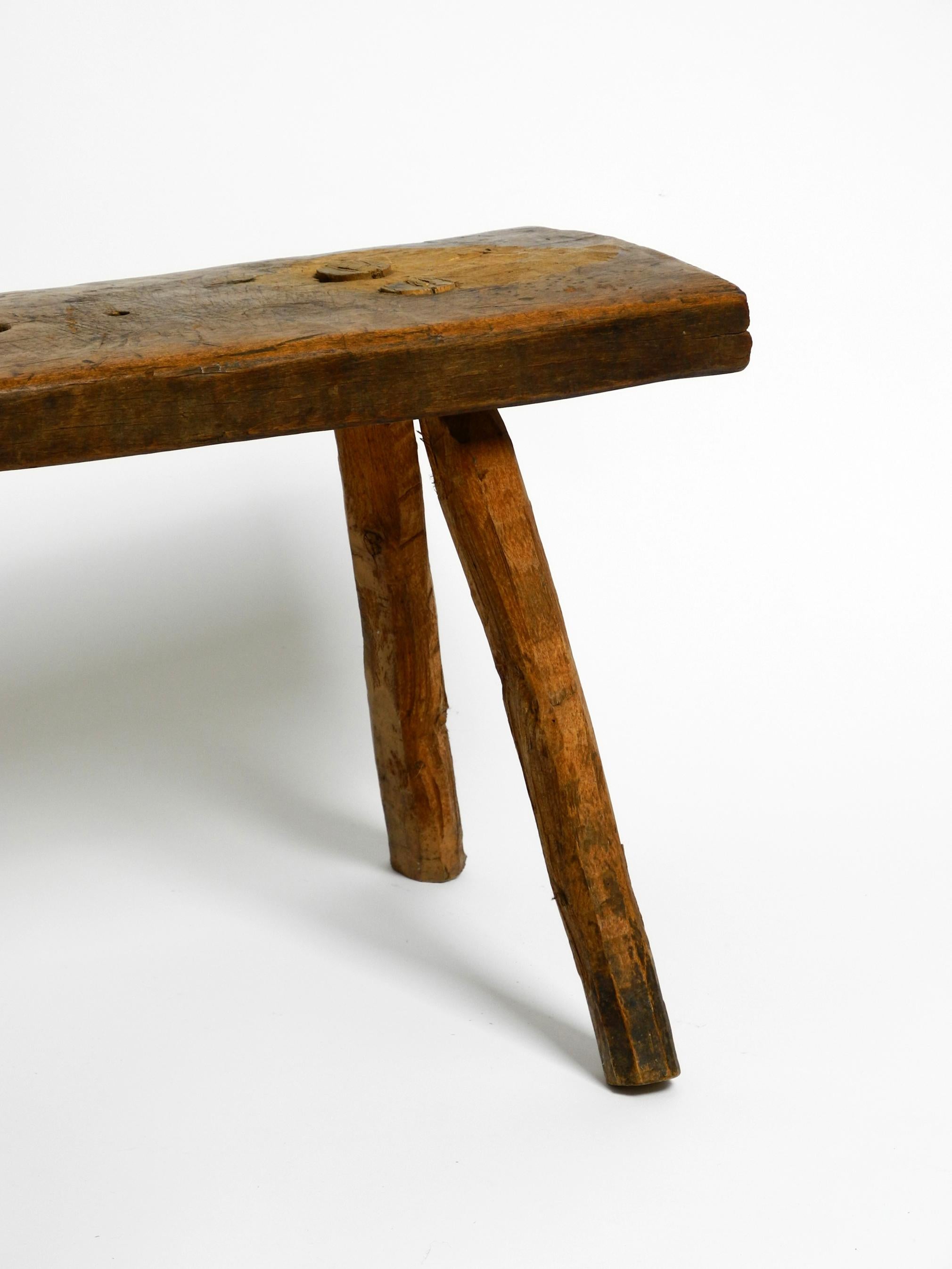 Beautiful Four-Legged Mid Century Solid Wood Stool with a Gorgeous Patina For Sale 1