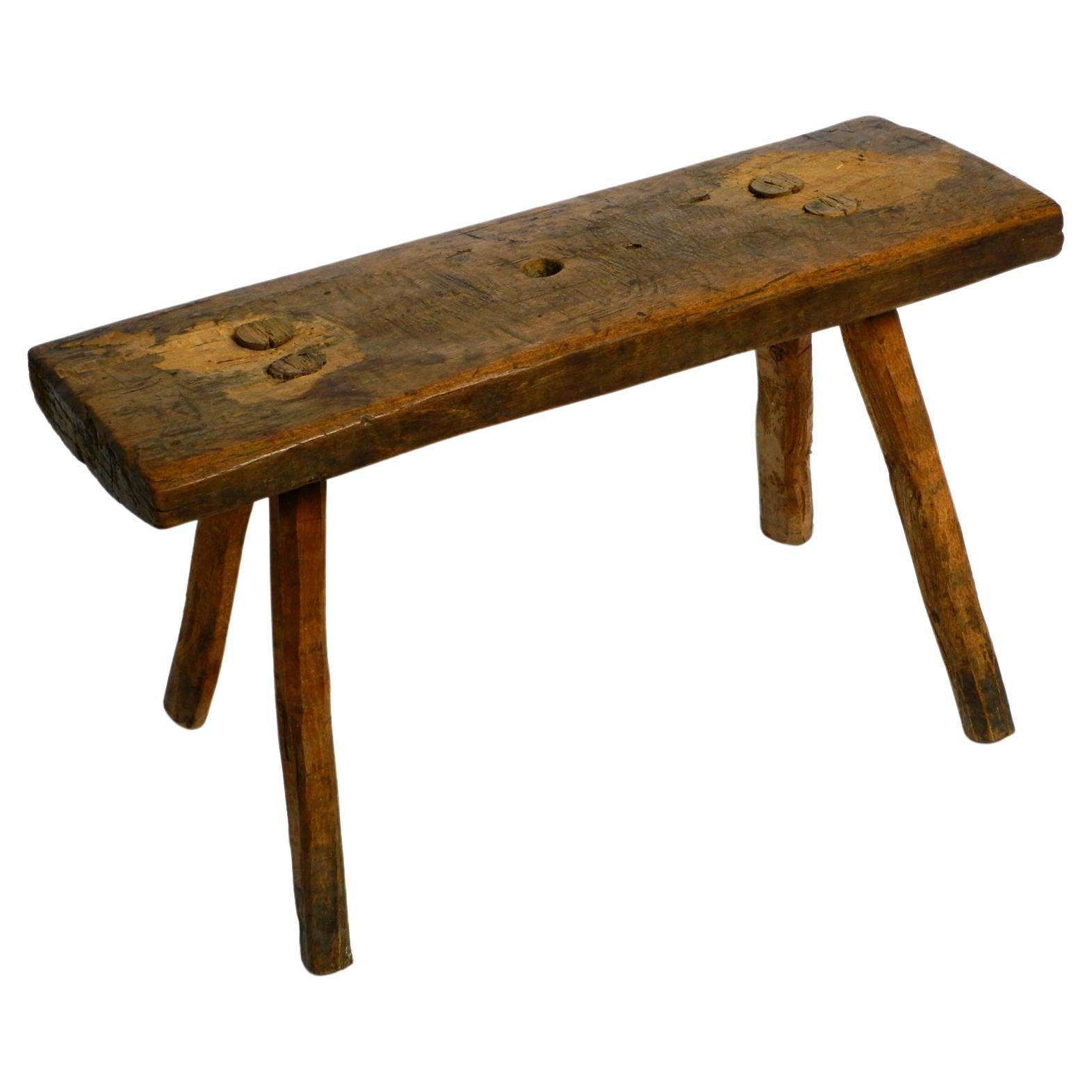 Beautiful Four-Legged Mid Century Solid Wood Stool with a Gorgeous Patina For Sale