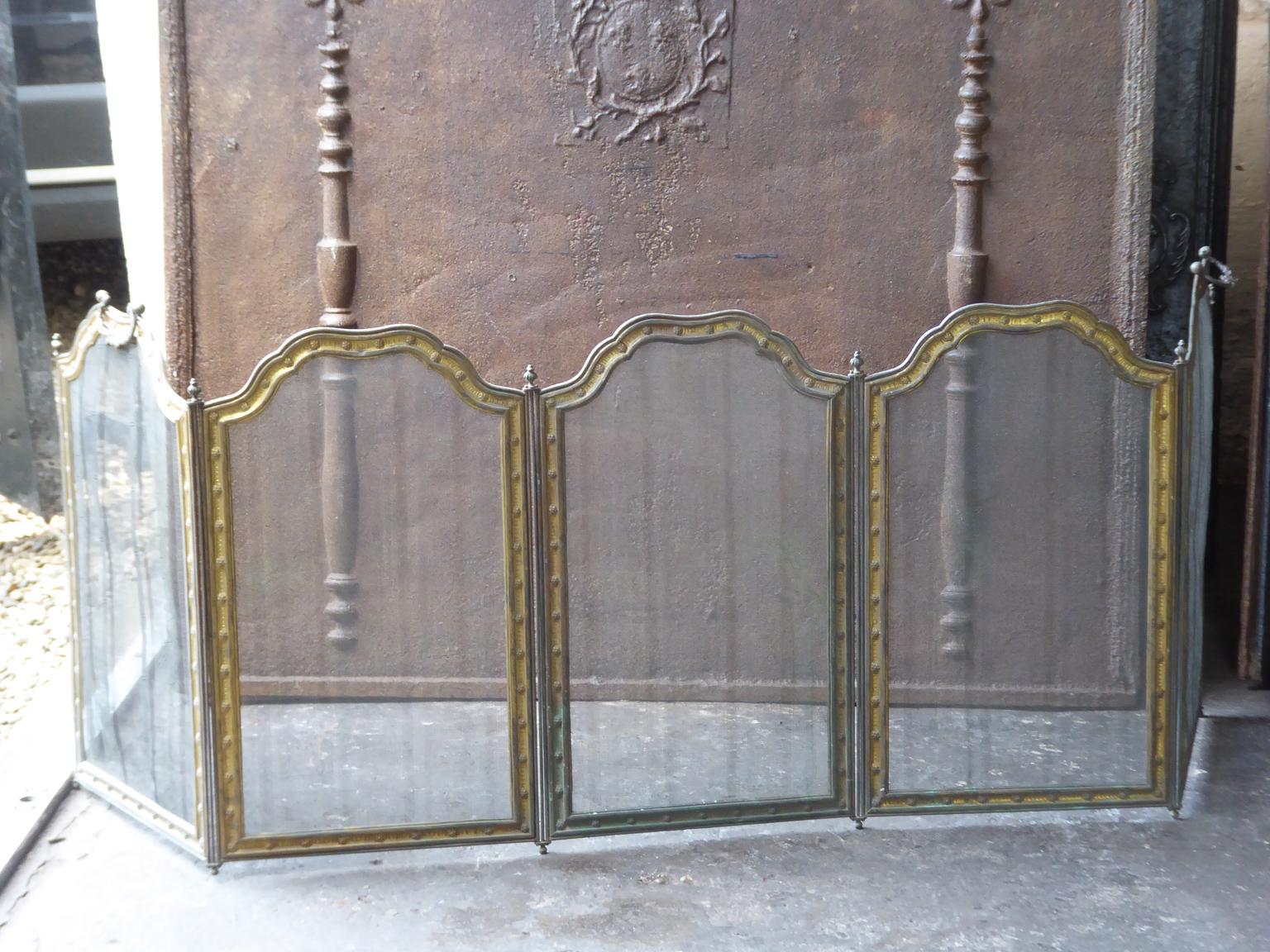 19th-20th century French Napoleon III five panel fireplace screen. The screen is made of brass, iron and iron mesh. The screen is in a good condition and is fully functional. 

Allez Frères from Paris was known circa 1900 for their good home and