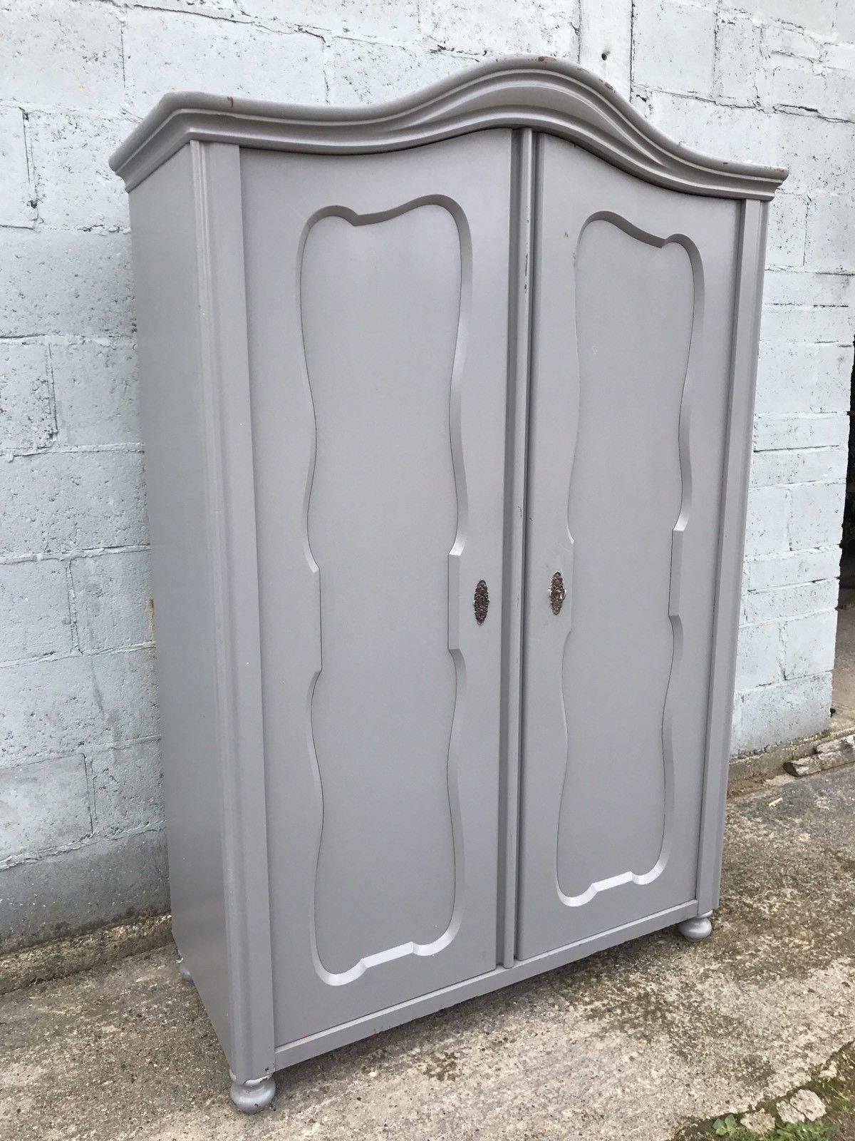 This is a beautiful French larder/cupboard or wardrobe.



It's been painted in grey color, slightly distressed.



Double carved door opens up to good storage. Can be fitted with shelves or hanging rails as an extra, if