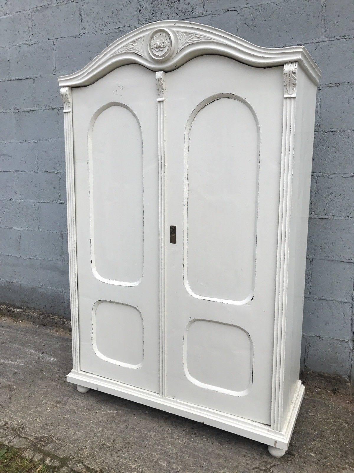 This is a beautiful French larder/cupboard or wardrobe.

It's been painted in white color, slightly distressed.

Double carved door opens up to good storage. Can be fitted with shelves or hanging rails as an extra, if needed.

Dimensions: