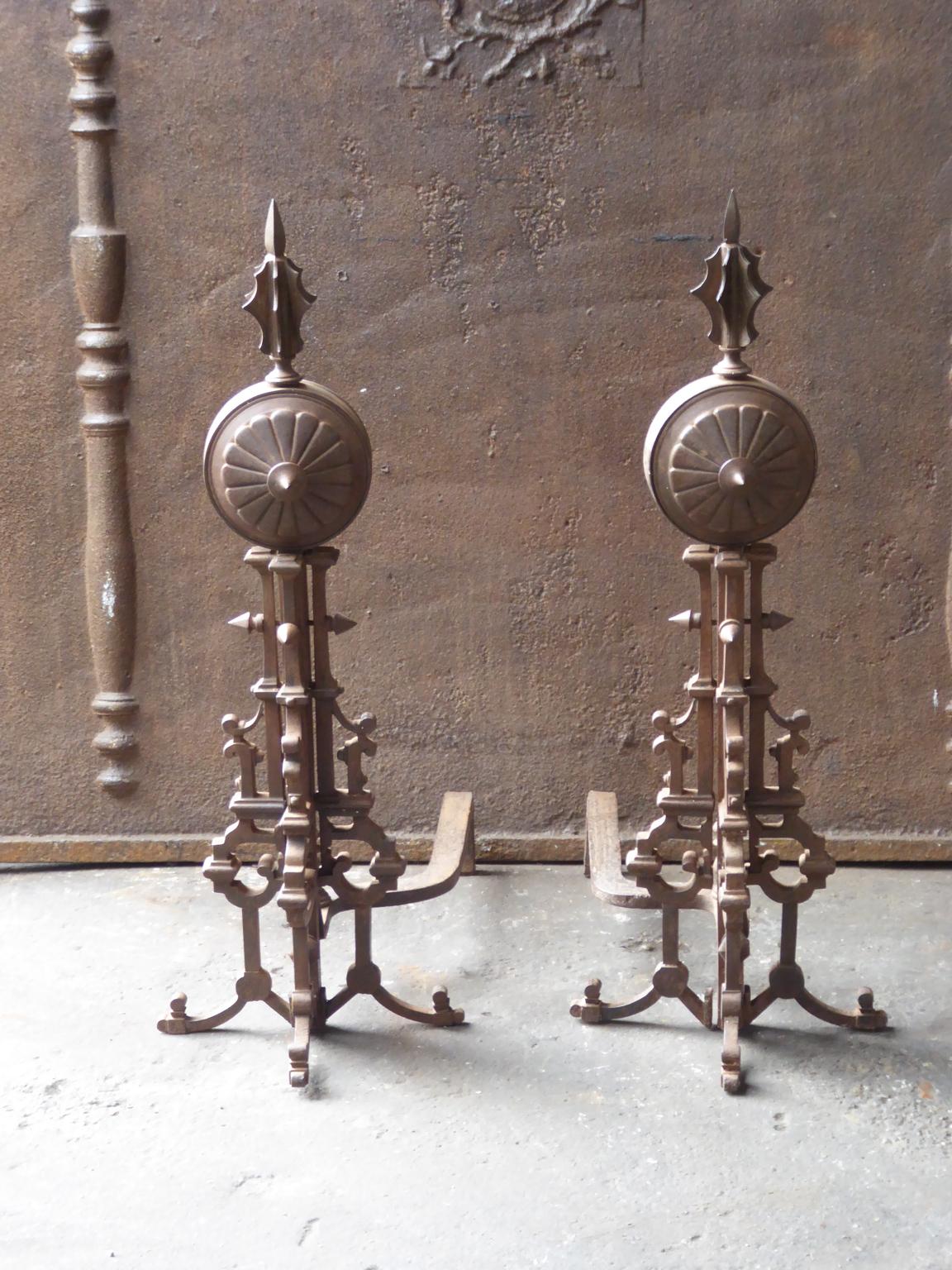 Early 20th century French Art Deco andirons made of wrought iron. The andirons are in a good condition and fit for use in the fireplace.