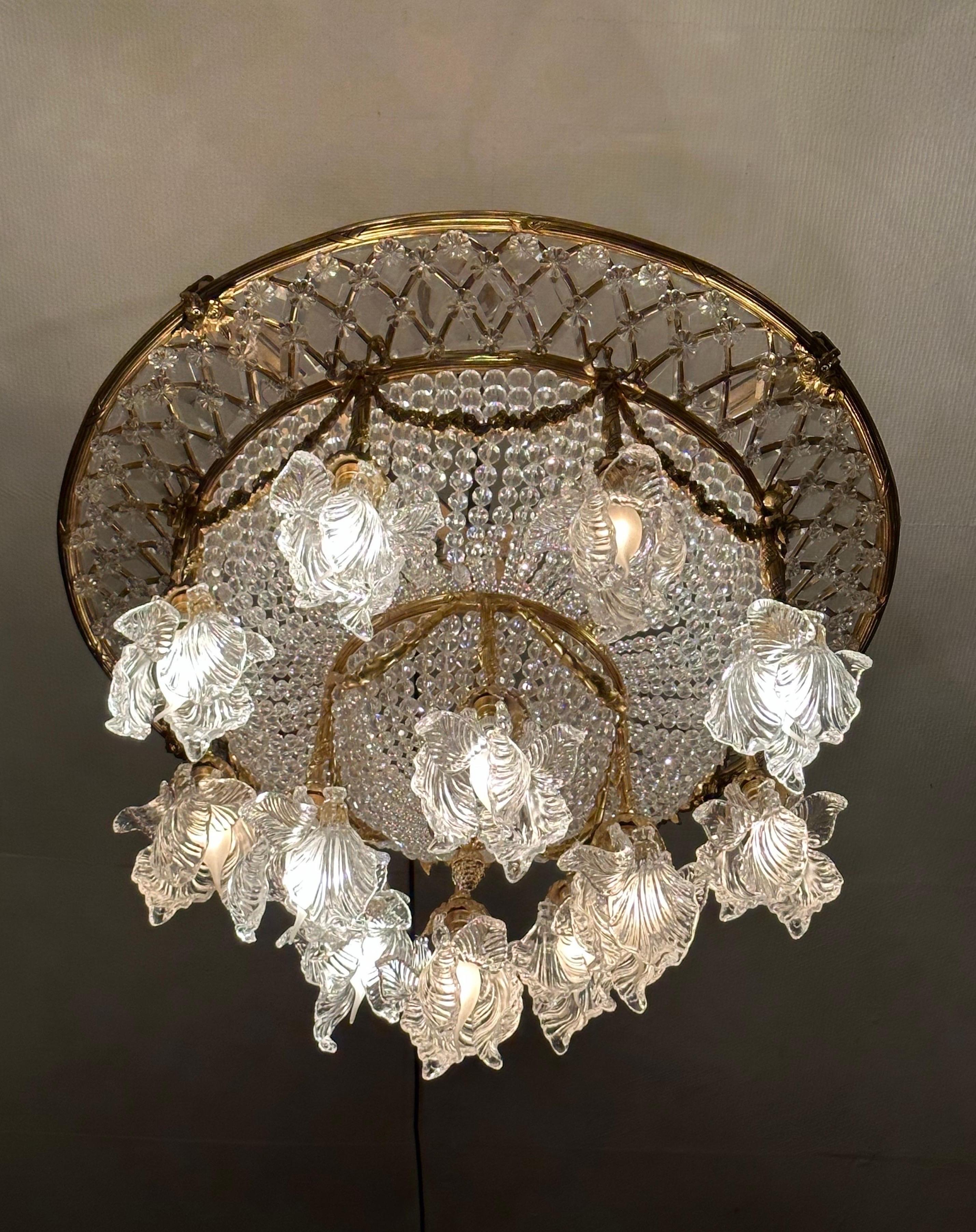 Introducing a stunning French Crystal Art Deco Chandelier that will instantly elevate your space with its timeless beauty and Art Deco allure.

Meticulously crafted in France, this chandelier captures the essence of the Art Deco movement with its