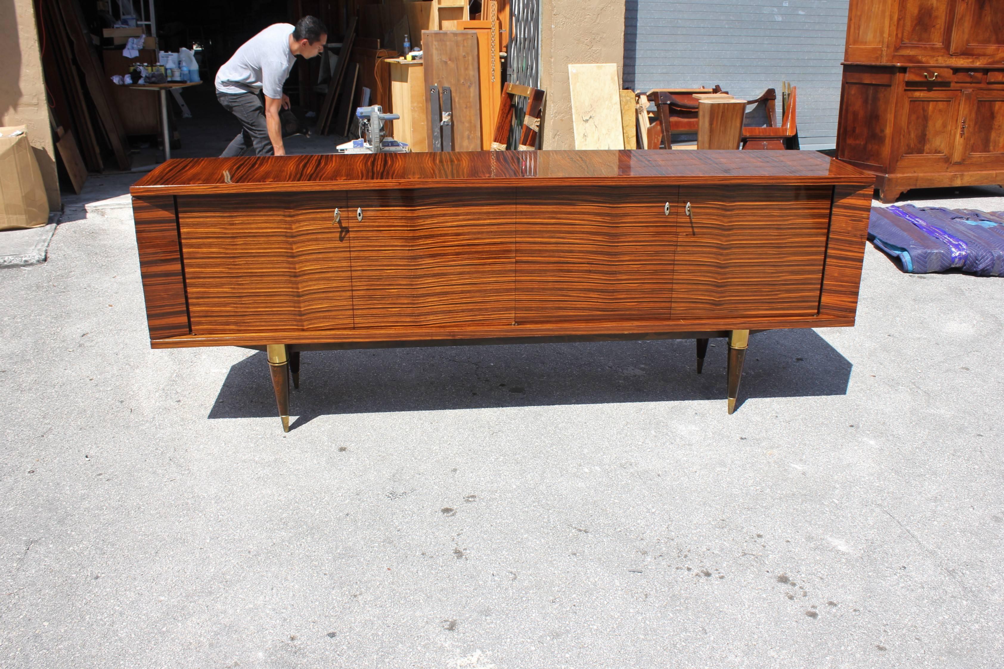 Description beautiful French Art Deco exotic Macassar ebony sideboard / buffet, circa 1940s. Very nice sideboard, the sideboard are in very good condition, with two drawers inside and all three shelves adjustable and you can remove the shelves if