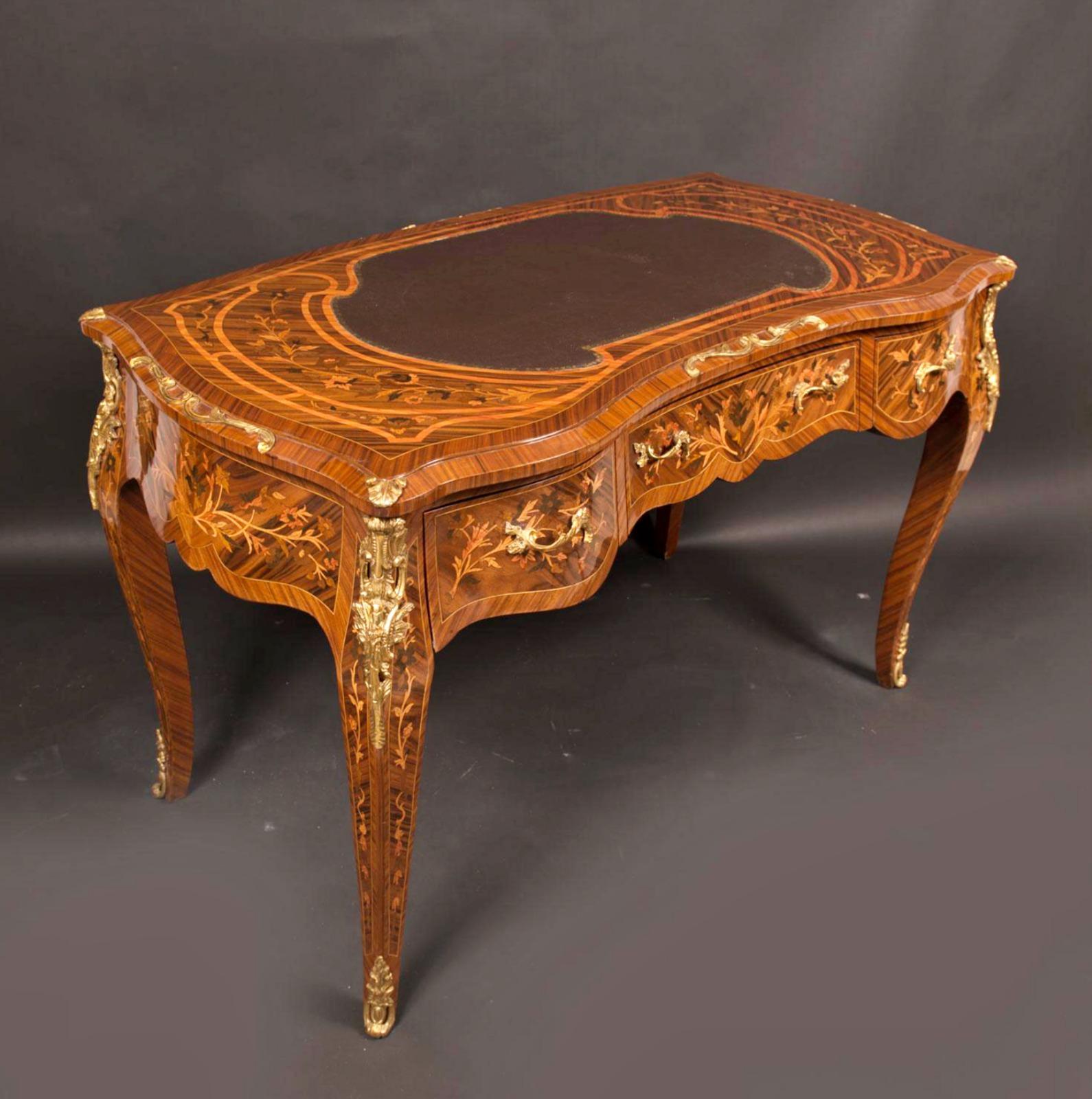 Beautiful French Bureau 19th/20th Century

with three drawers, four curved legs, border and top on all sides, hard wood body with rose wood veneer and rich floral intarsias in different fruit woods, gilted bronze mounts, top with leather center,