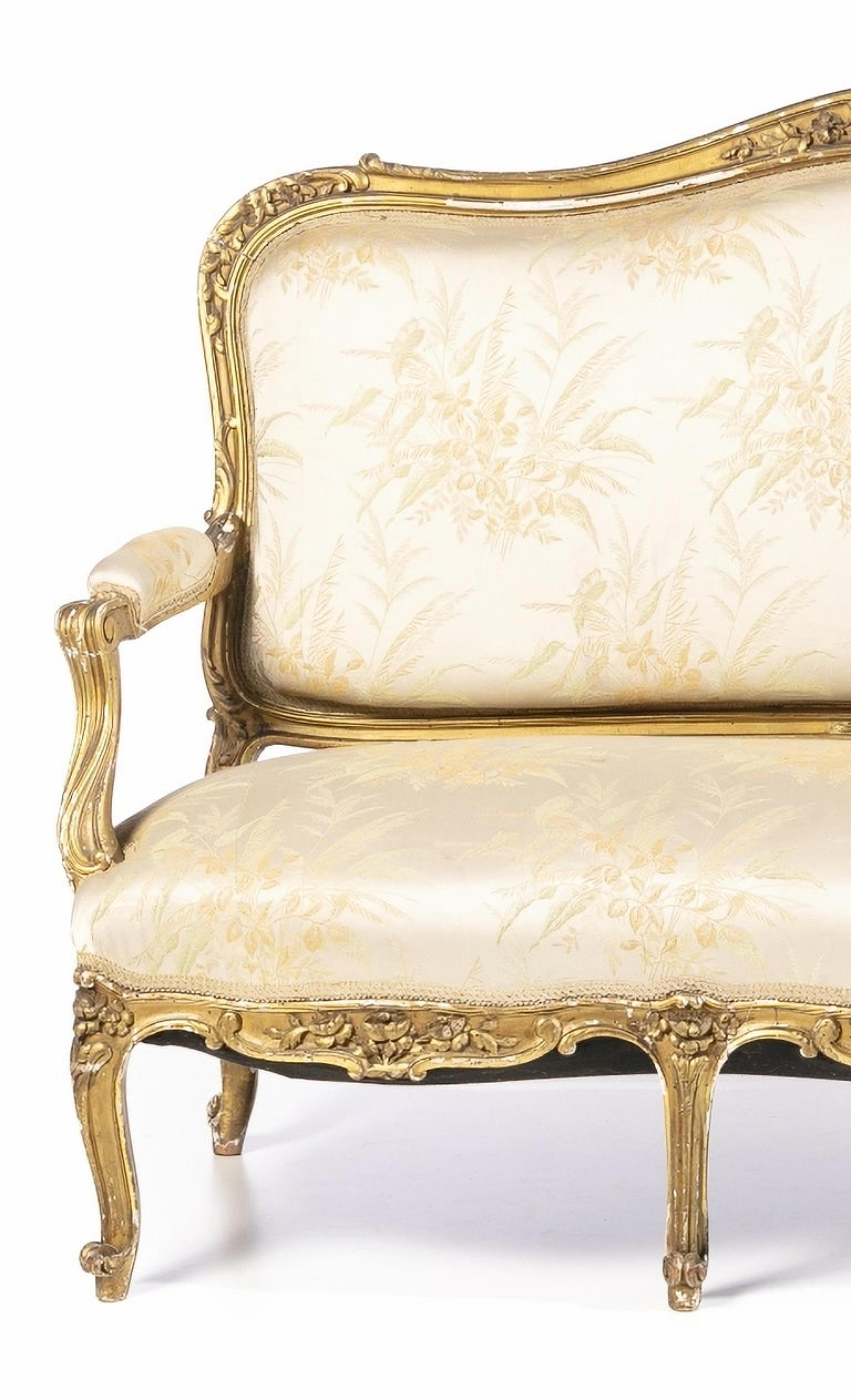 Beautiful French Canape 18th Century

French from the 18th century,
in carved and gilded wood. 
Upholstered seat, back and arms. 
Dim.: 112 x 169 x 60 cm.
good condition