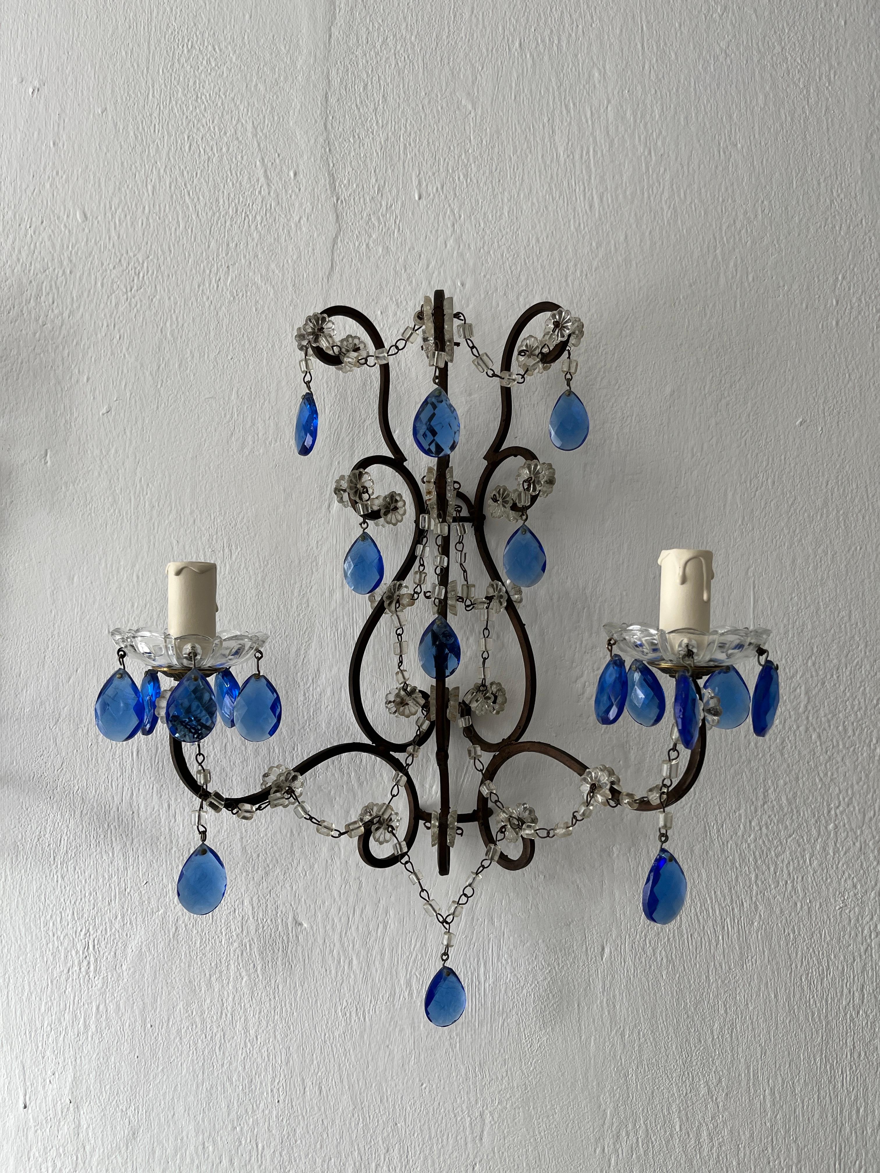 Housing 2 lights each. These will be rewired with certified UL US sockets for the USA and appropriate sockets for the rest of the world. Crystal bobeches dripping with cobalt blue prisms.  Macaroni bead swags throughout.  Re wired and ready to hang.