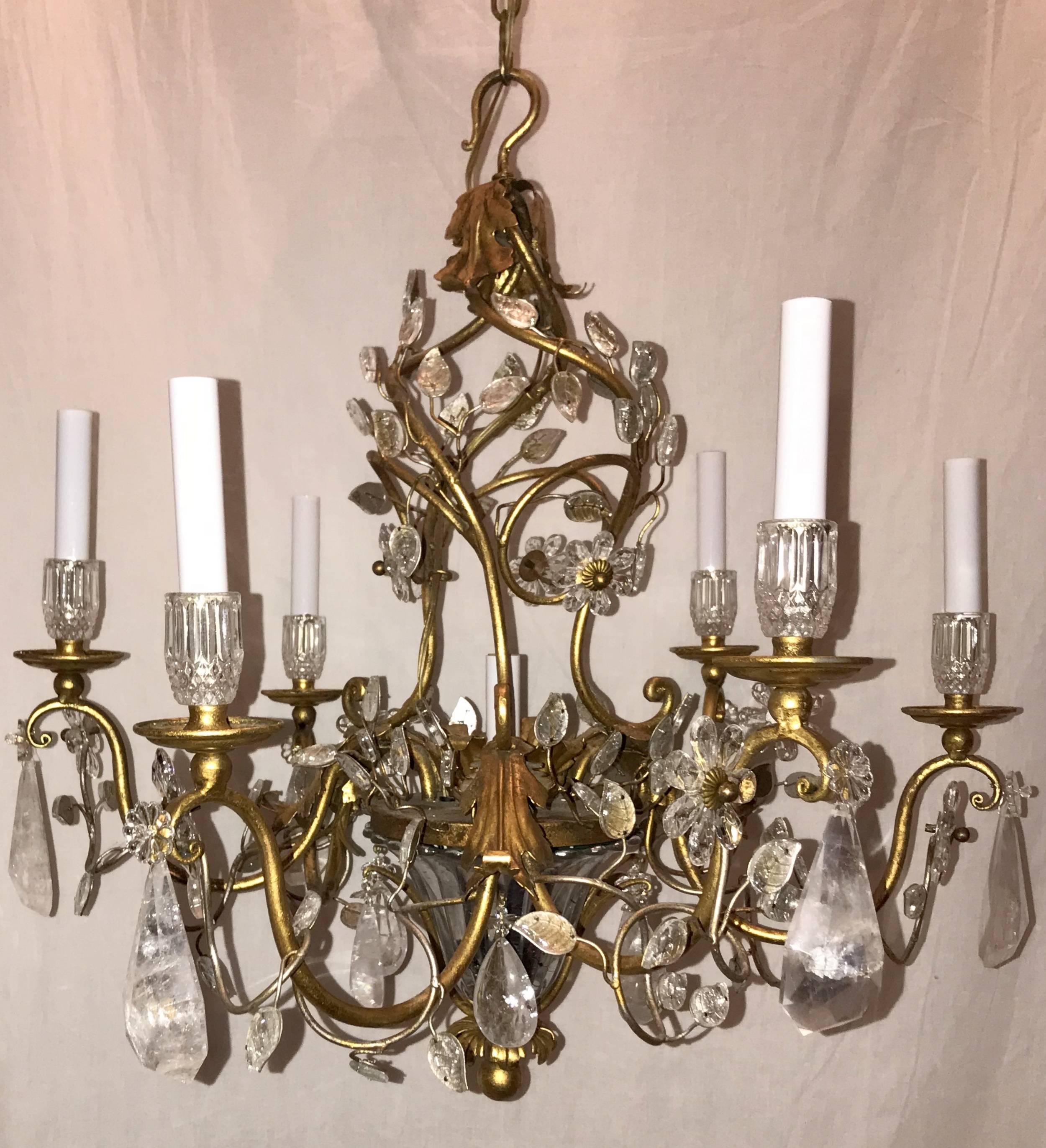 A Beautiful French gold gilt midcentury Baguès style, rock crystal and leaf basket form chandelier with six candelabrum lights
 
Actual measurements:
27