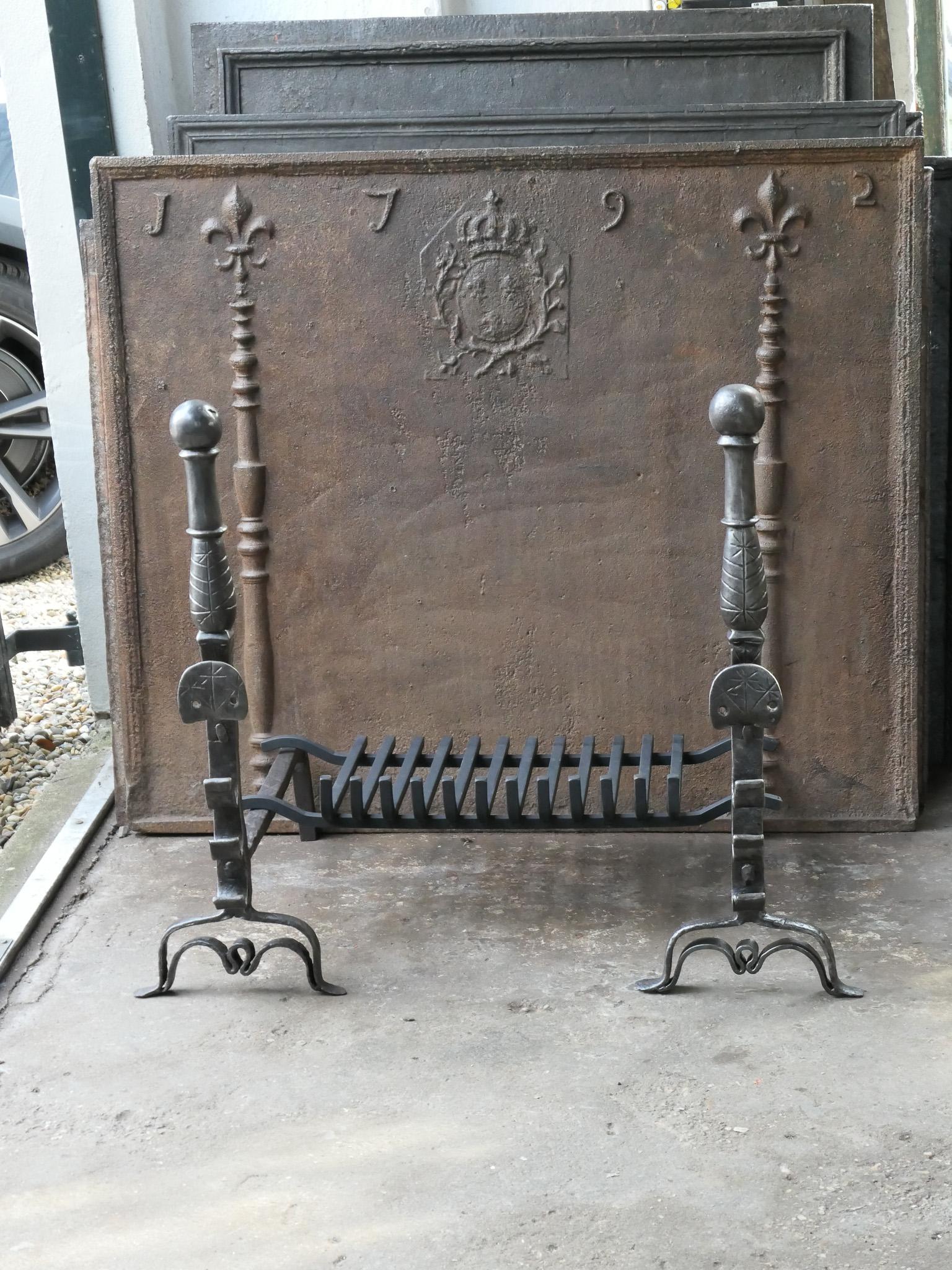 Beautiful 17th century French Gothic fire grate with period andirons and a recently forged grate. Made of wrought iron. The condition is good. 







