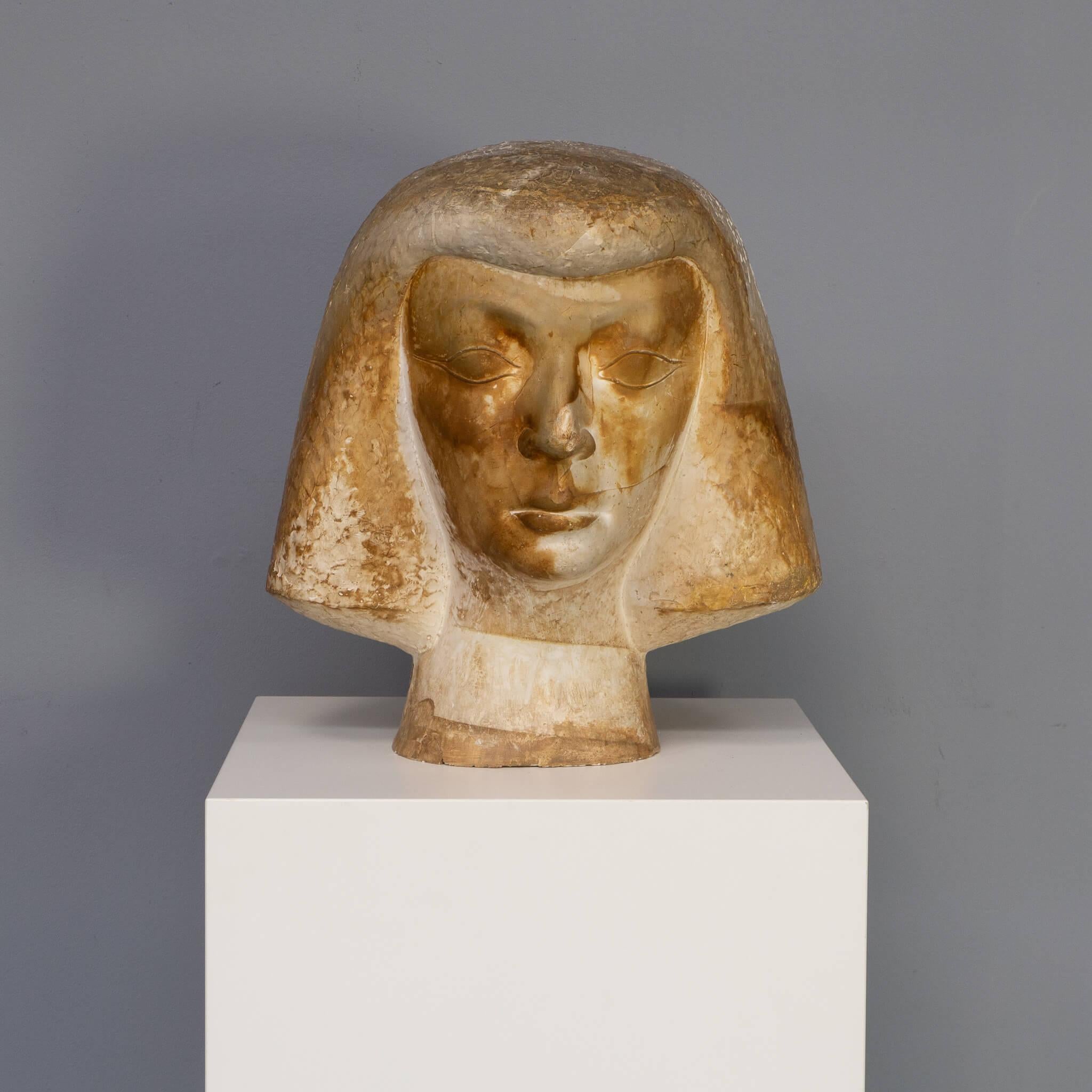 From a gallery in Nice Cannes France this large head has a signature of Aoussauti. Very little is to find about this signature but for sure this is a unique masterpiece. It is a beautiful large sculpture in french plaster with lots of bronze