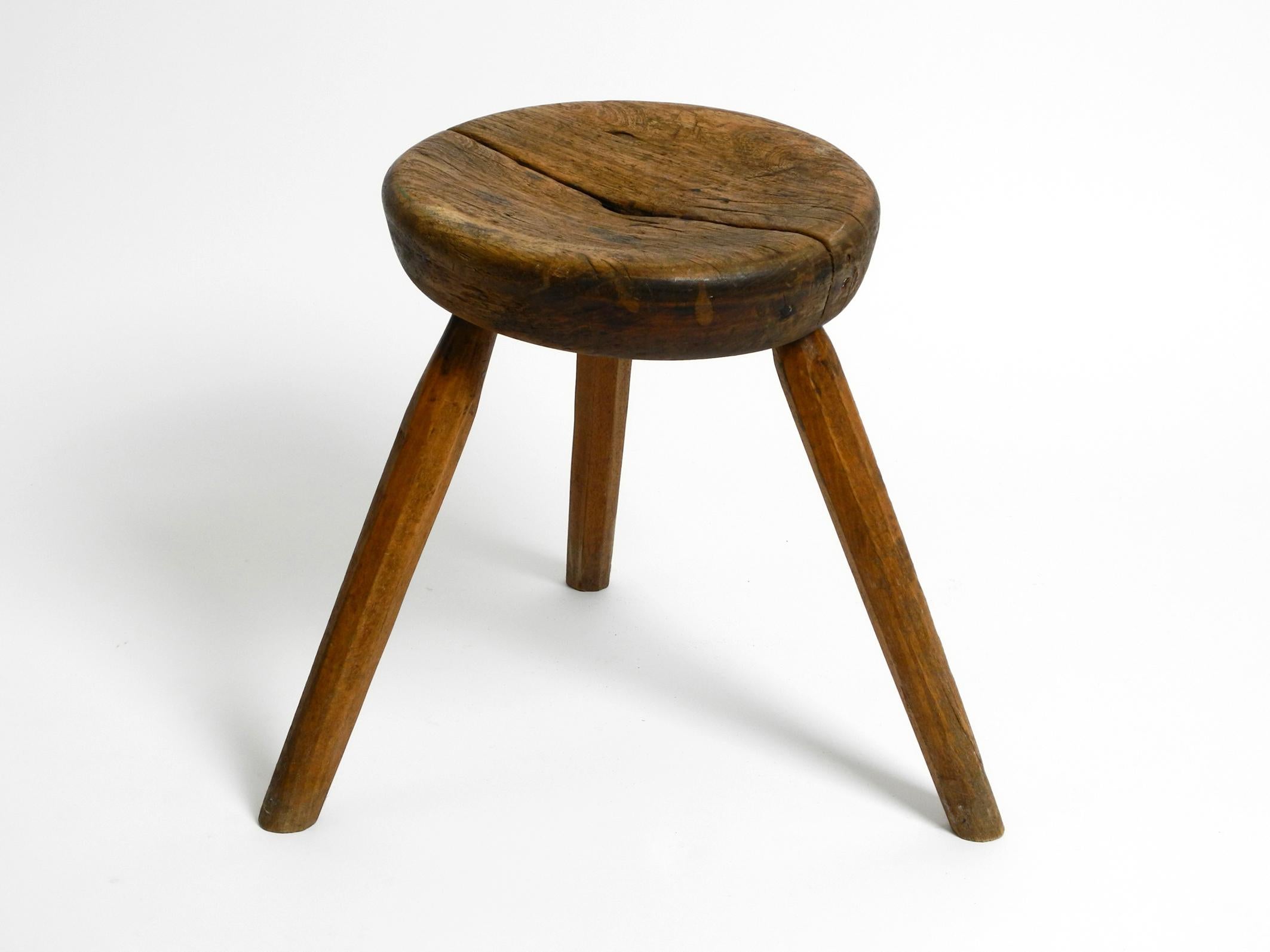 Beautiful original French tripod mid century solid wood stool.
Great mid century design with a wonderfully beautiful patina.
Very robust and heavy built can also be used as a small side table.
Seat consists of two halves.
Not wobbly, everything