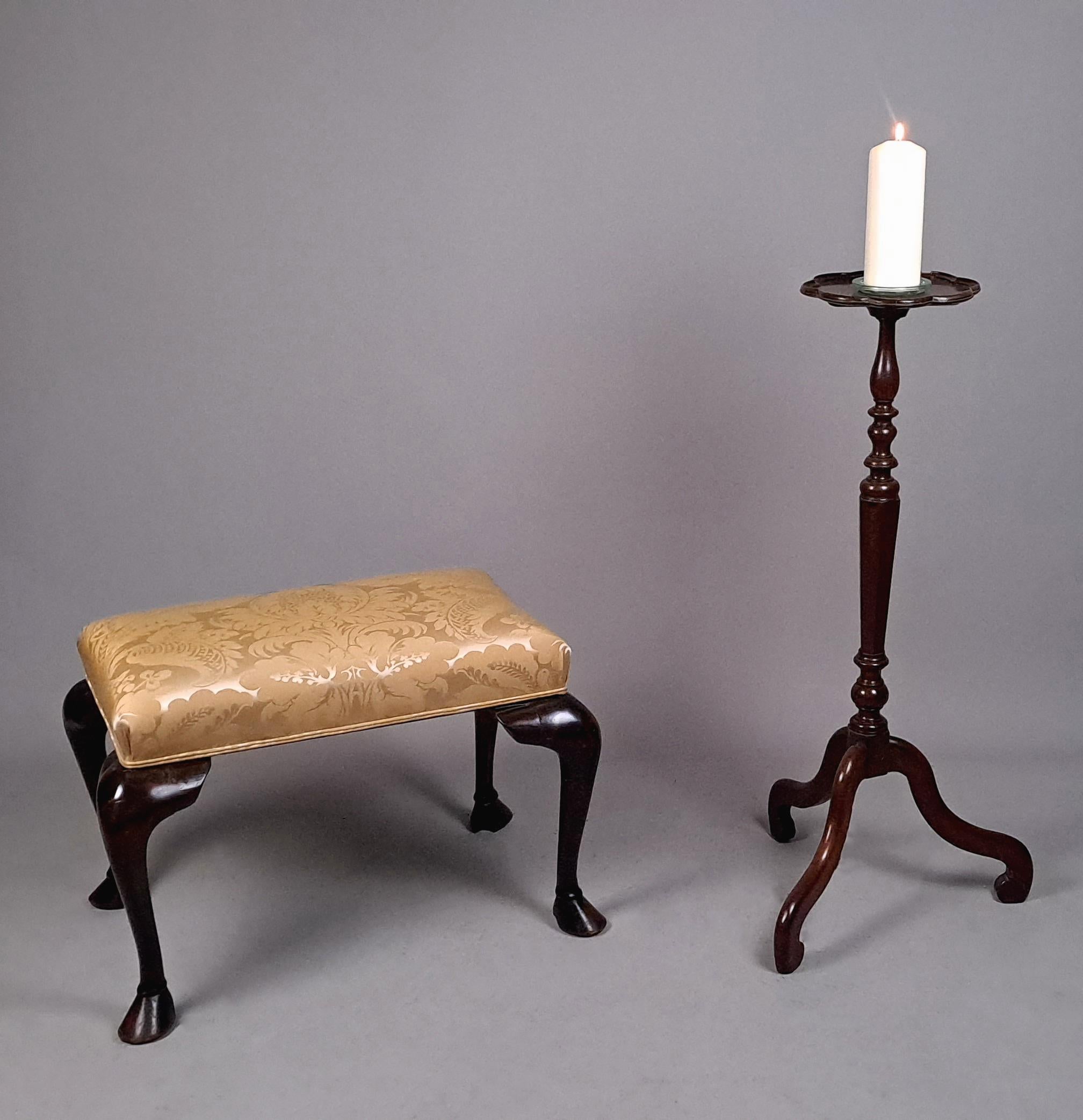 A very handsome and robust foot stool with substantial cabriole legs terminating in pony hoof shaped feet with well carved hoofs and hocks.

Newly and professionally re-padded and upholstered in an ivory/mink coloured pure silk upholstery fabric by