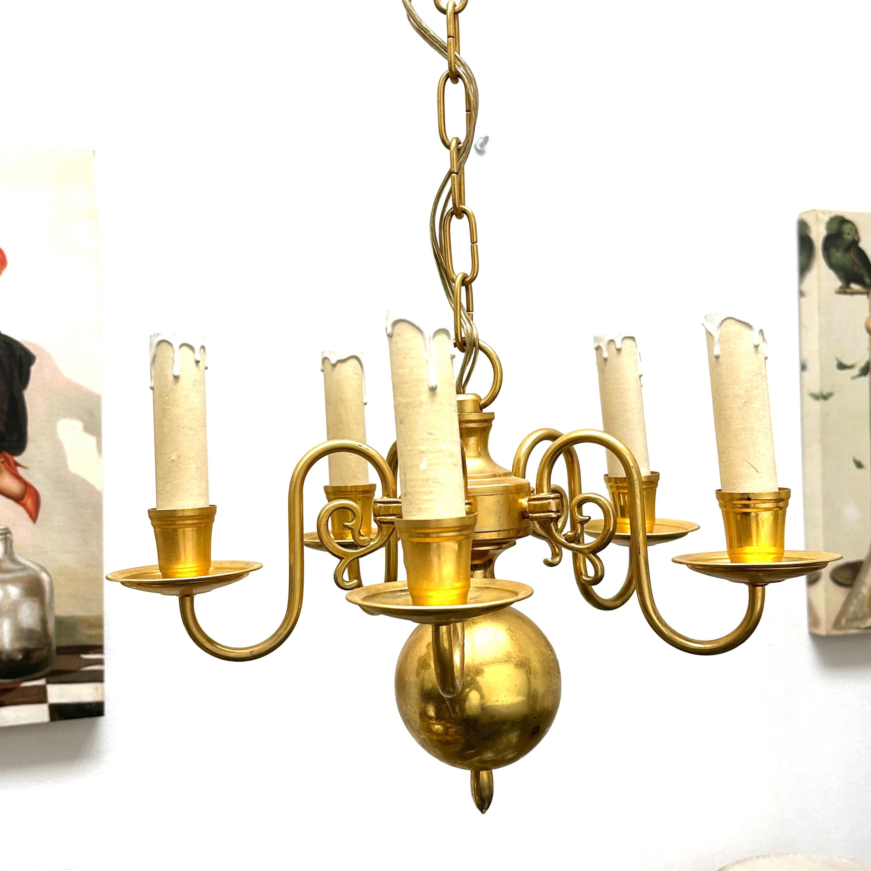 Add a touch of opulence to your home with this charming chandelier! Perfect brass Metal to enhance any chic or eclectic home. Chandelier part itself measures approx. 10.5 inches high. We'd love to see it hanging in an entry hall or in a Living /