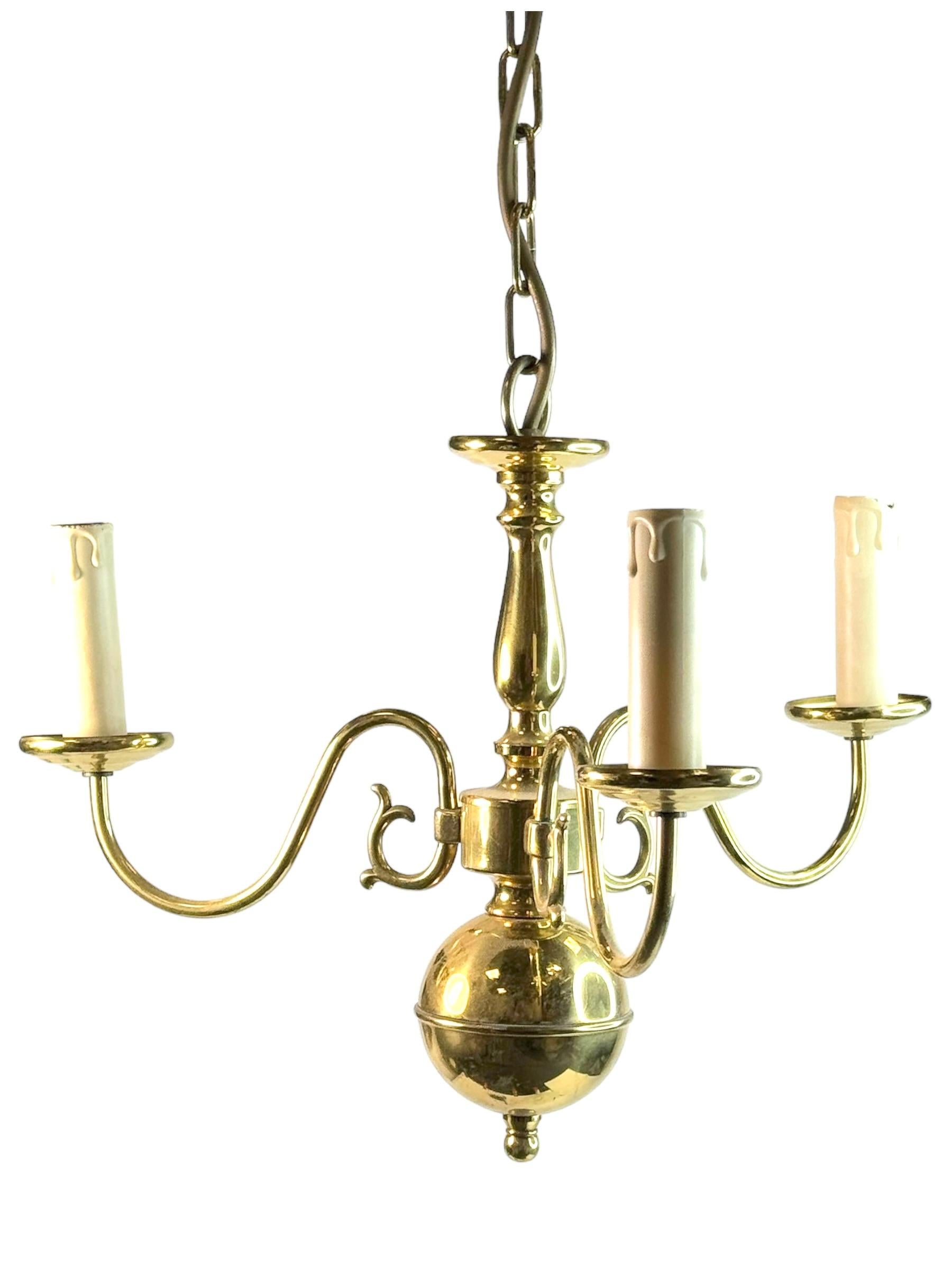 Add a touch of opulence to your home with this charming chandelier! Perfect polished Brass Metal to enhance any chic or eclectic home. We'd love to see it hanging in an entry hall or in a Living / Dinning room area. Built in the 1960s, attributed to
